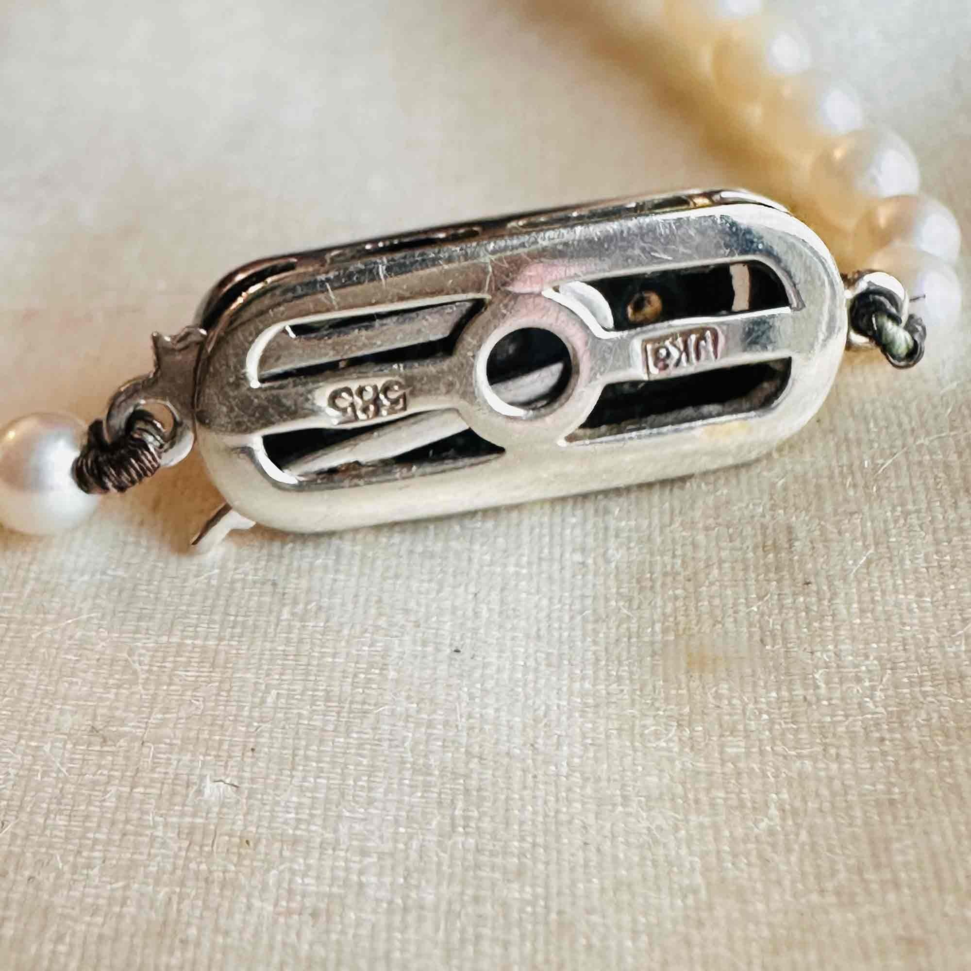 rear view close up of Saltwater Cultured Pearl & 14ct White Gold Diamond Clasp Necklace
