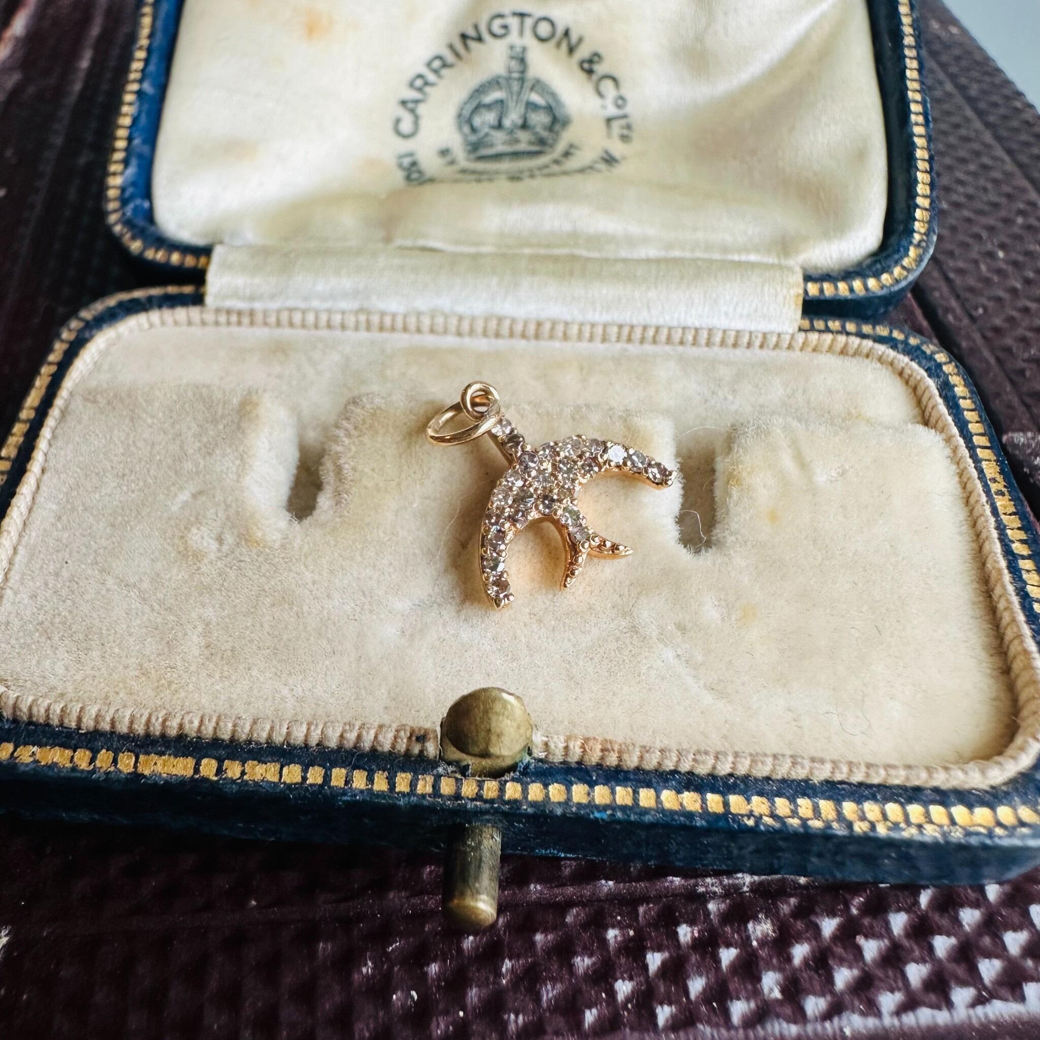 14ct Rose Gold & Diamond Swallow Charm Pendant, displayed on antique box