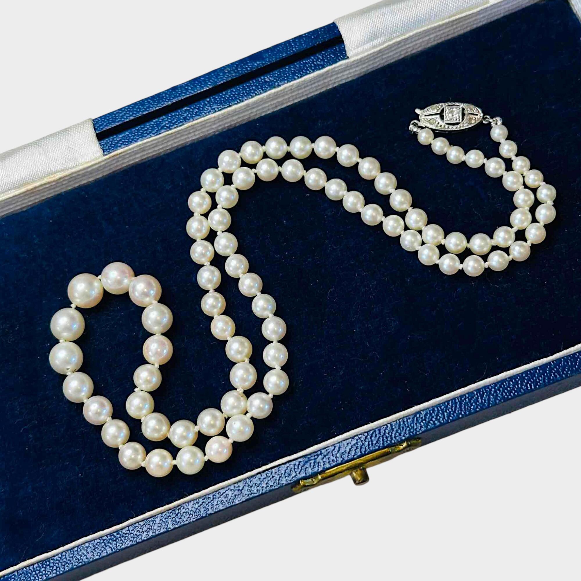 14ct White Gold & Diamond Saltwater Cultured Pearl Necklace displayed in antique box with grey background