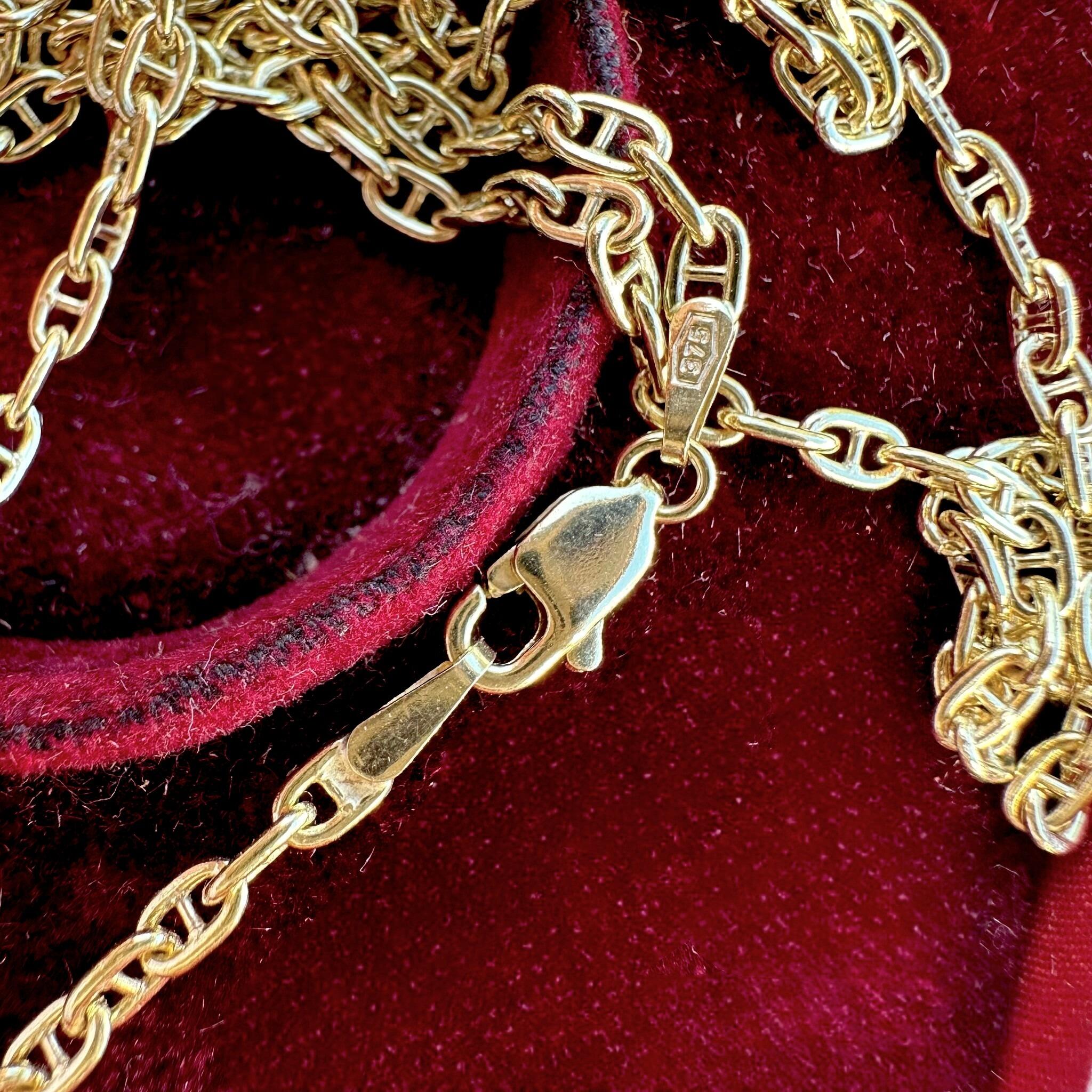 Gold Mariner Anchor Link Chain Necklace displayed laying in red velvet antique box