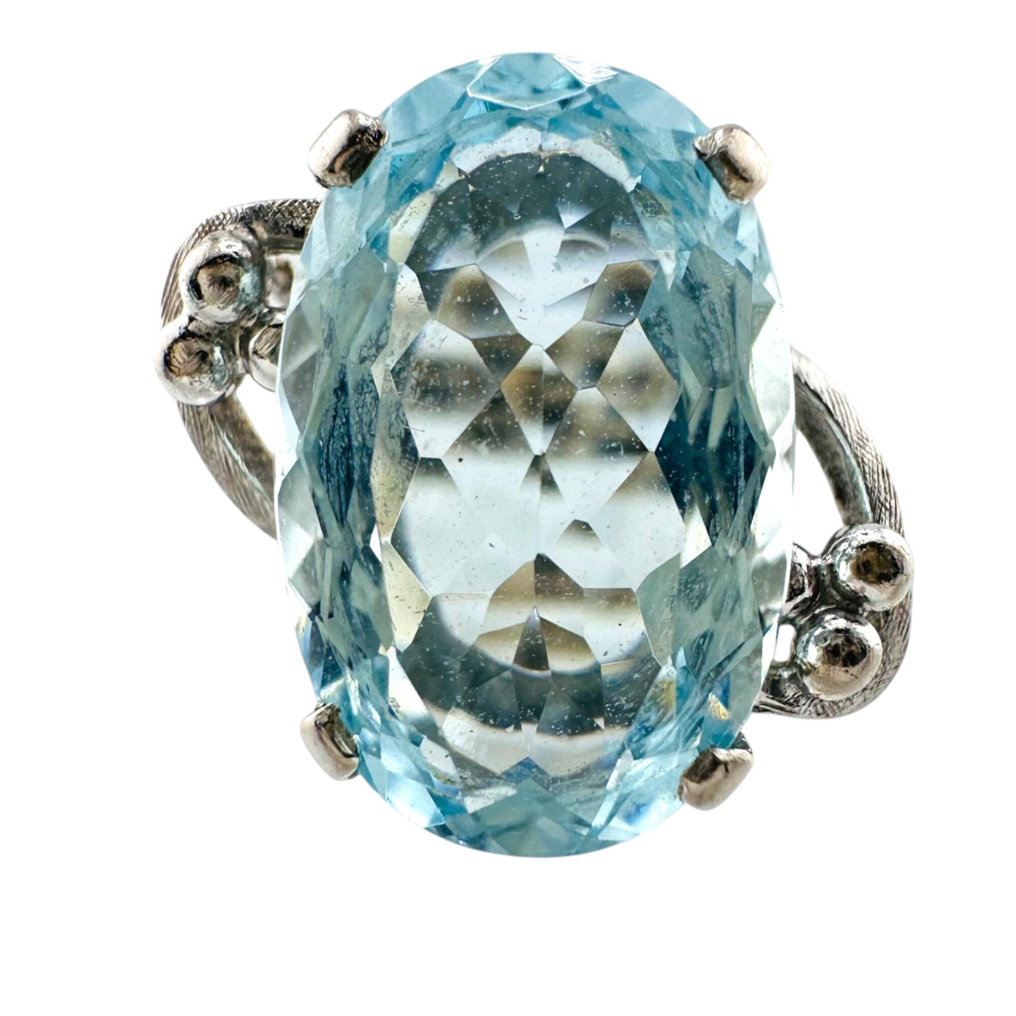 18ct white gold aquamarine cocktail ring on white background.