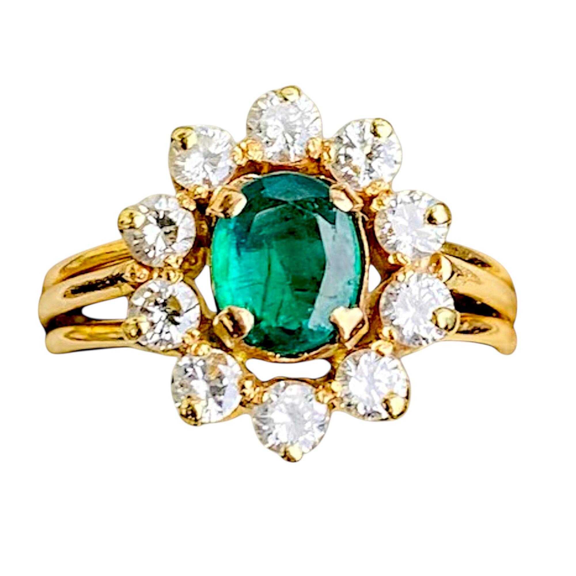 modern 18ct gold daisy ring with central oval emerald and diamond petals