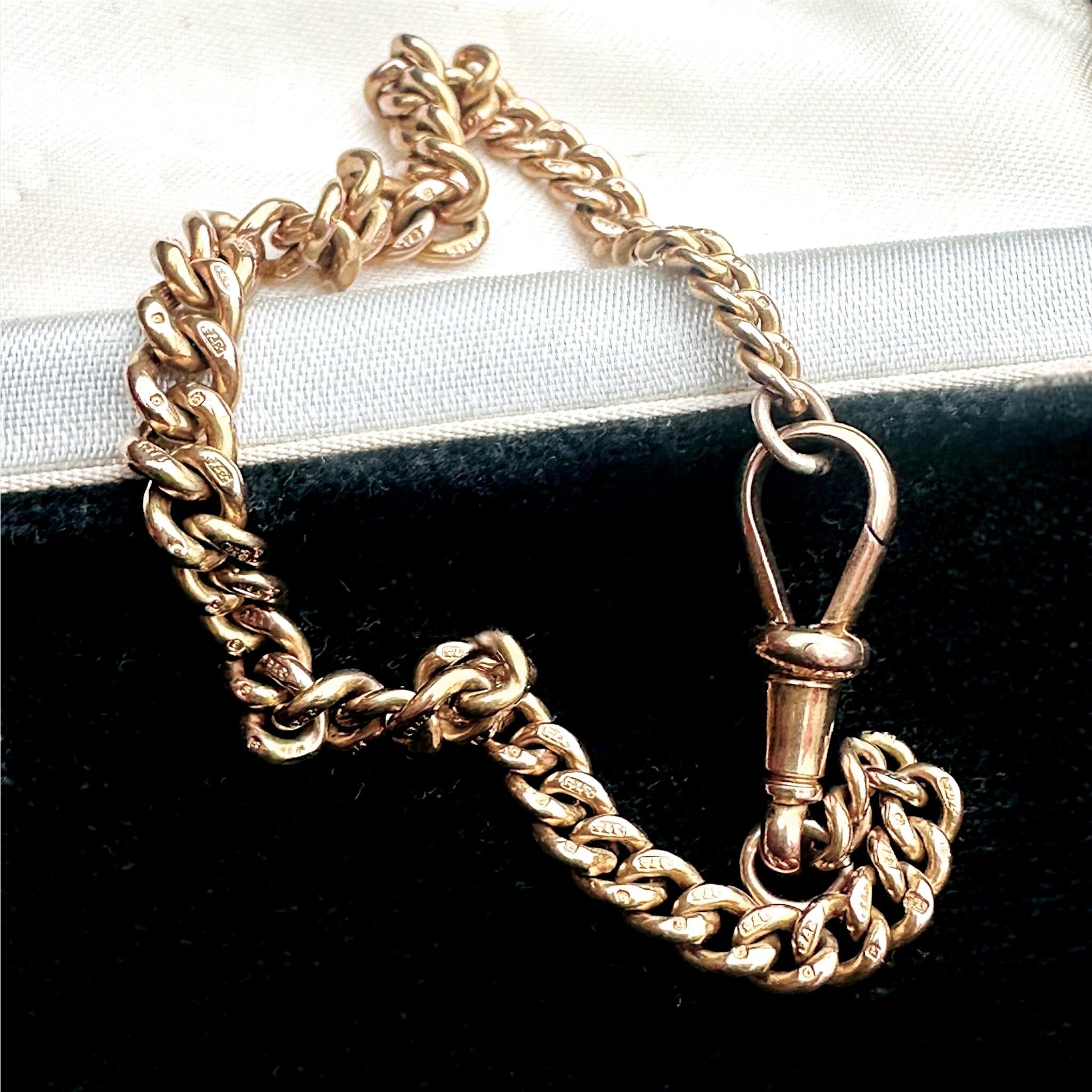 Antique Solid Rose Gold Albert Chain Bracelet & Dog Clip Clasp displayed on a antique box