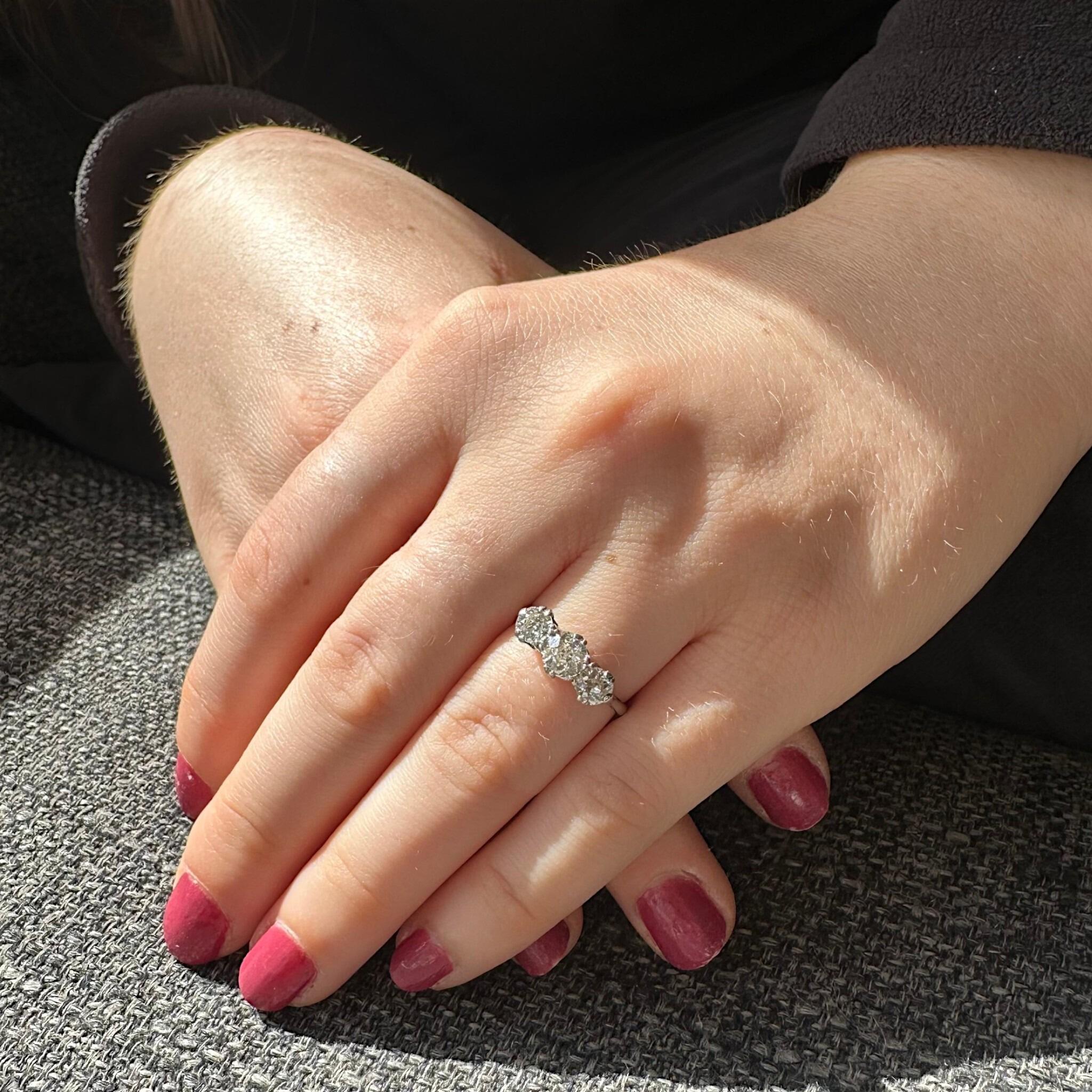Antique Art Deco18K White Gold & Platinum, Old European Cut Diamond Trilogy Ring displayed on models hand