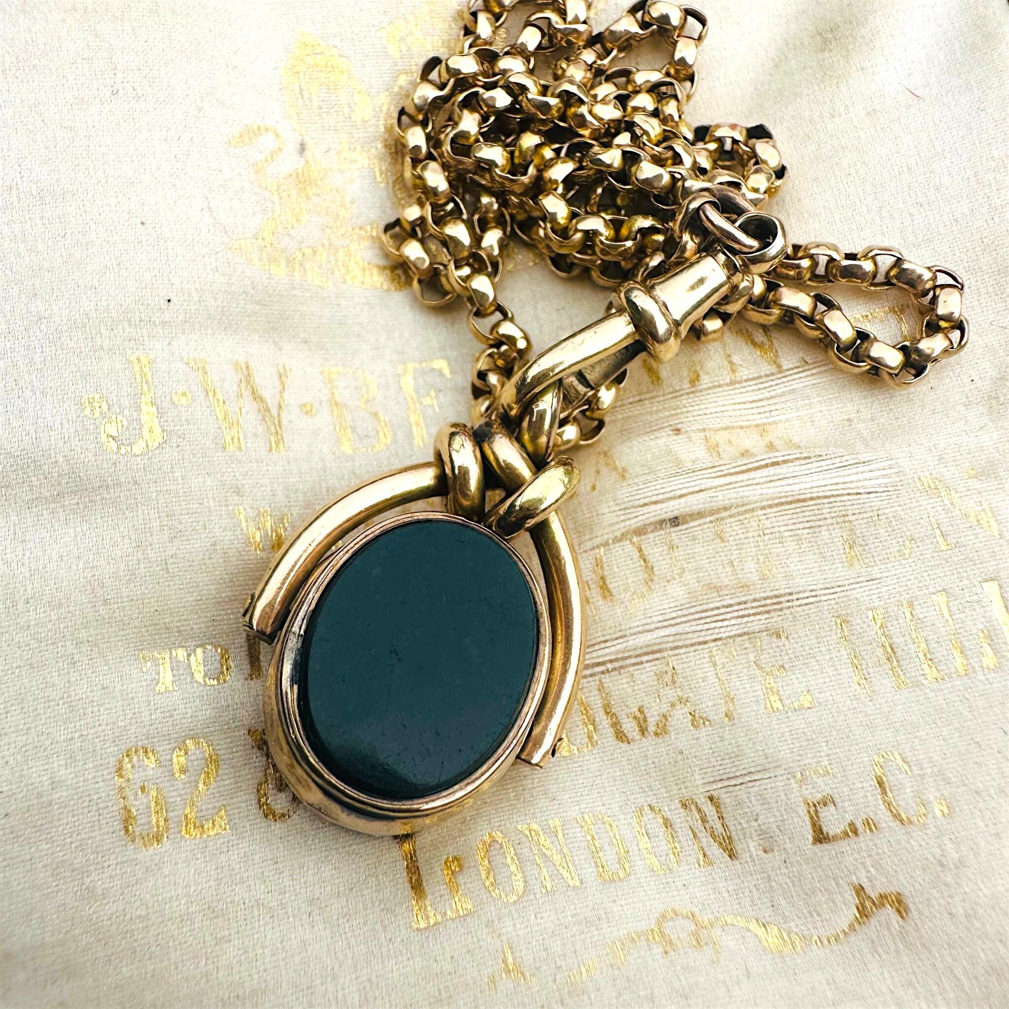Antique Victorian 9ct Gold Bloodstone & Carnelian Swivel Fob displayed on antique box