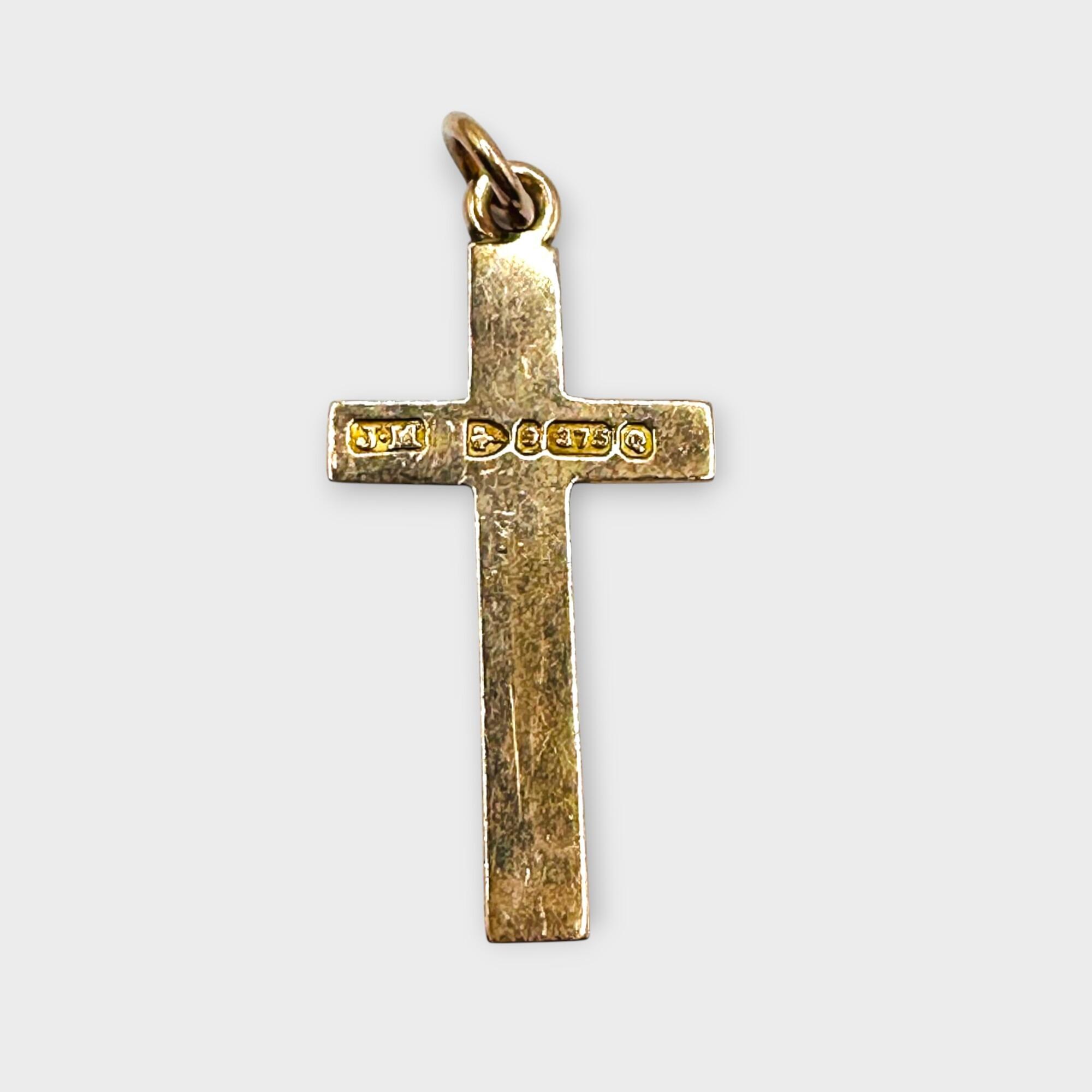 Victorian 9k rose gold engraved cross pendant on grey background