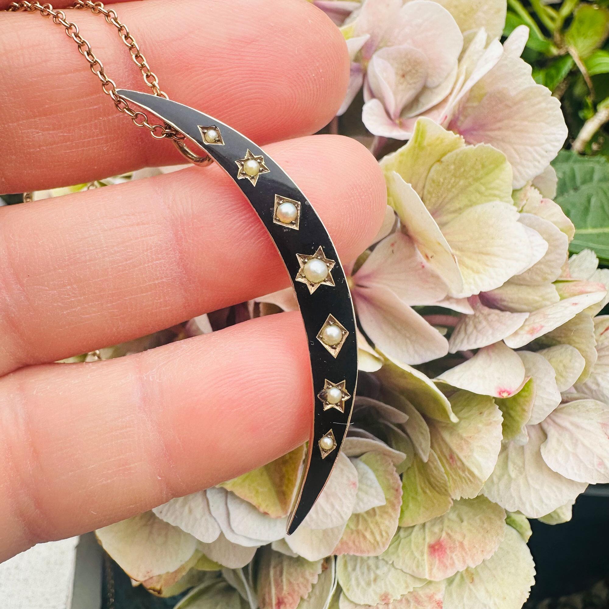 Victorian 15k Rose Gold Black Enamel & Pearl Crescent Moon Pendant on hand in garden