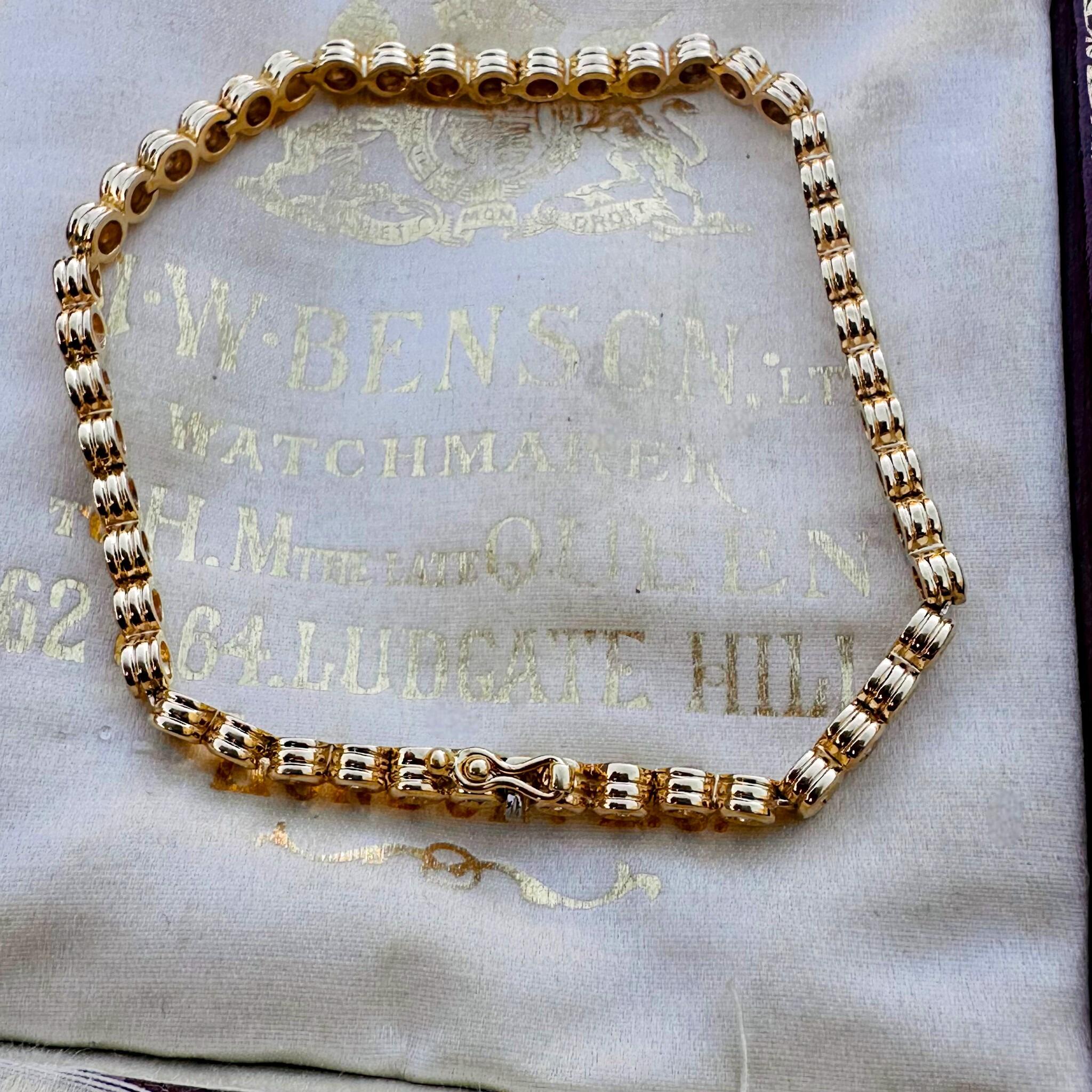 top view, 18ct Gold Diamond Line Tennis Bracelet displayed on antique box