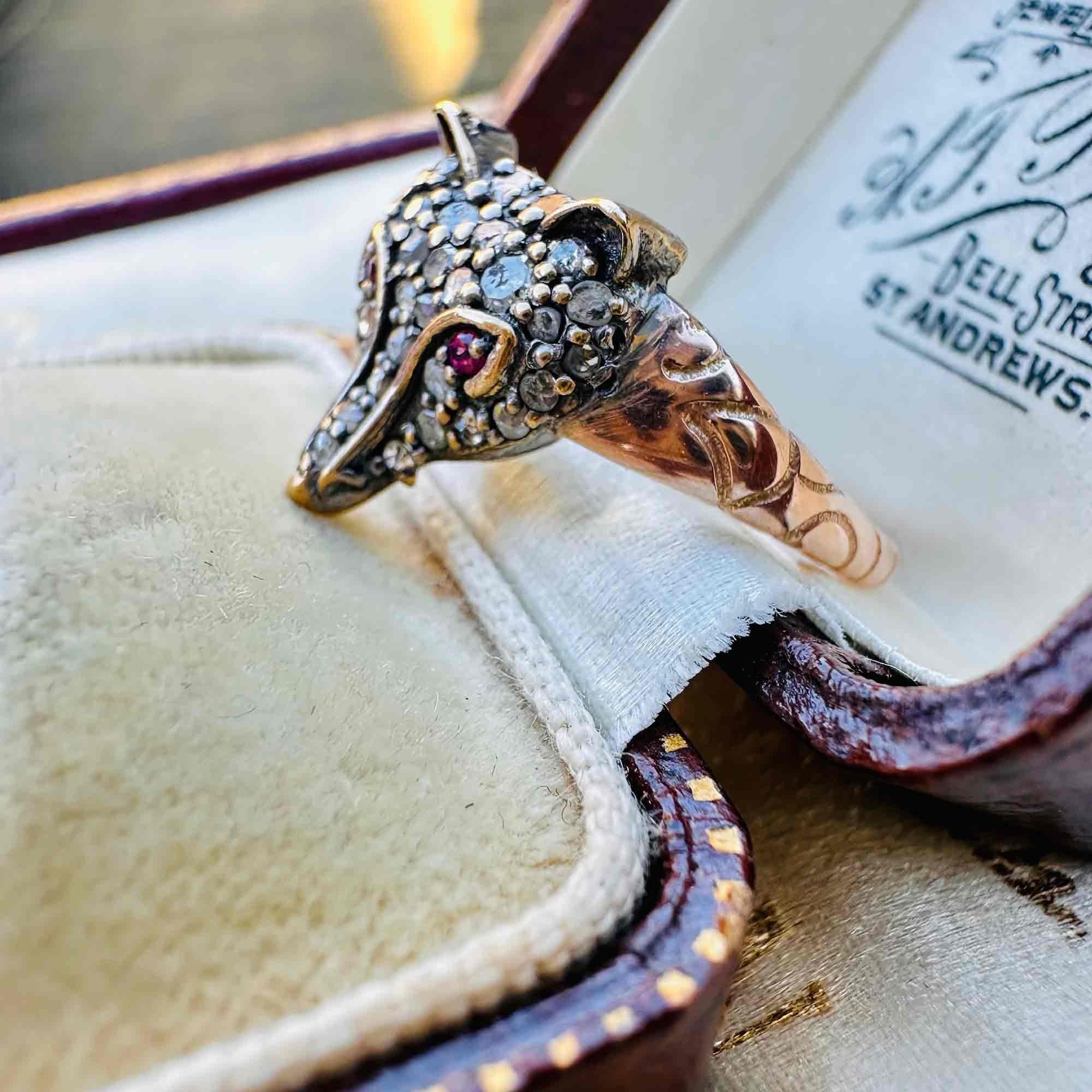 Side view of Rose Gold, Silver & Diamond & Ruby Eyed Fox Ring displayed in antique box