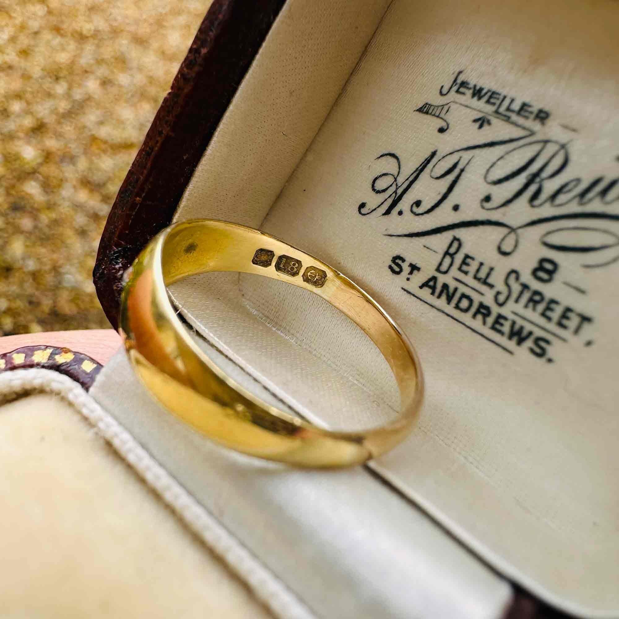 rear view of 18ct Gold & Diamond Star Set Gypsy Ring, displayed on antique box