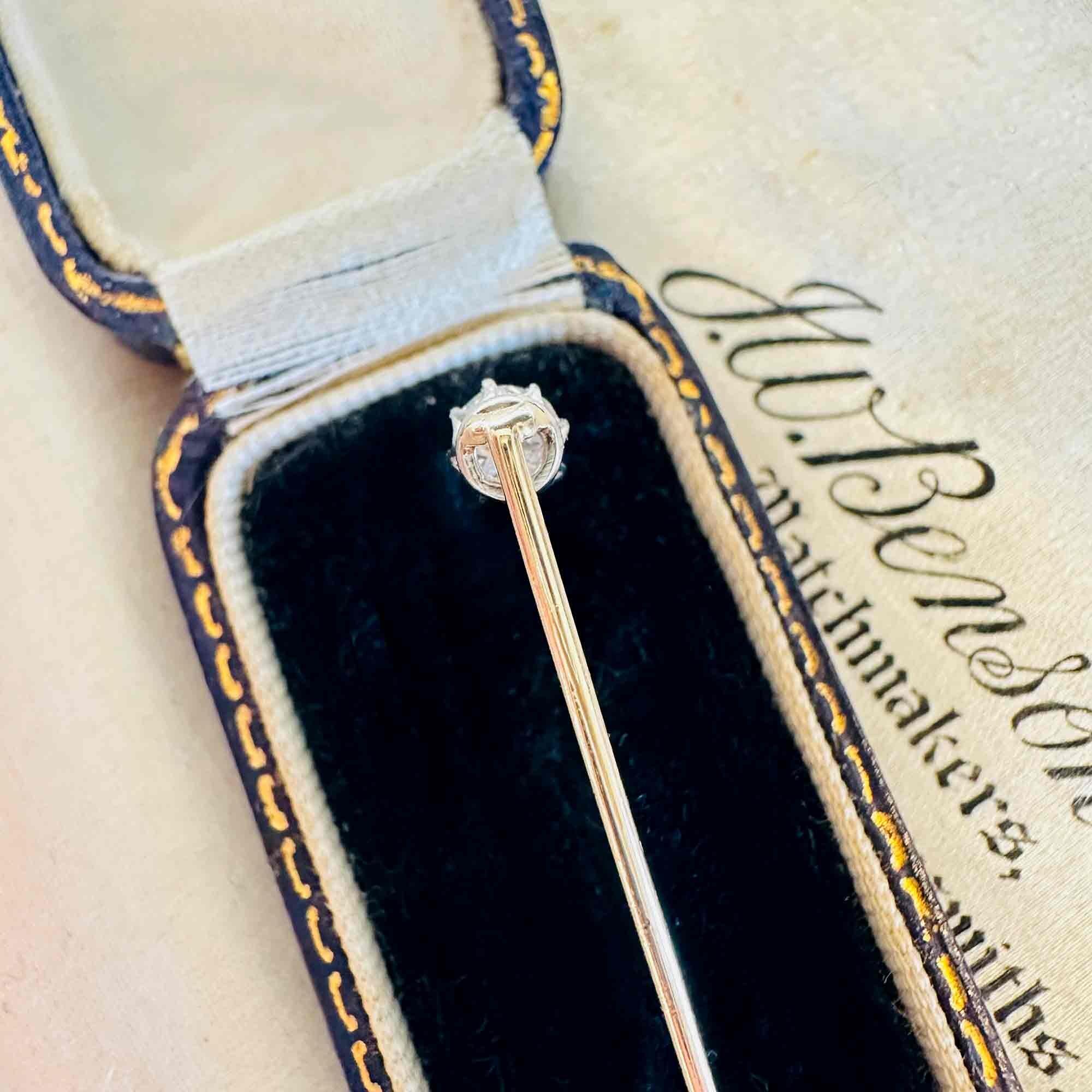 Edwardian 0.48ct Old European Cut Diamond Stick Pin & Original Box laying on other antique boxes