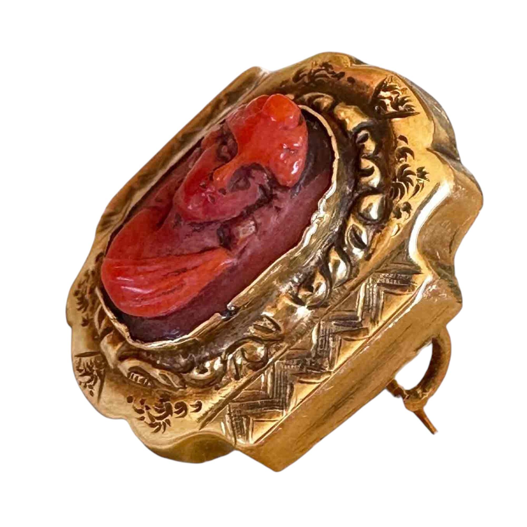 Victorian Coral brooch with carved 'portrait of a lady' in 18ct gold setting, deep orange-red coral, likely from Italy's Grand Tour.