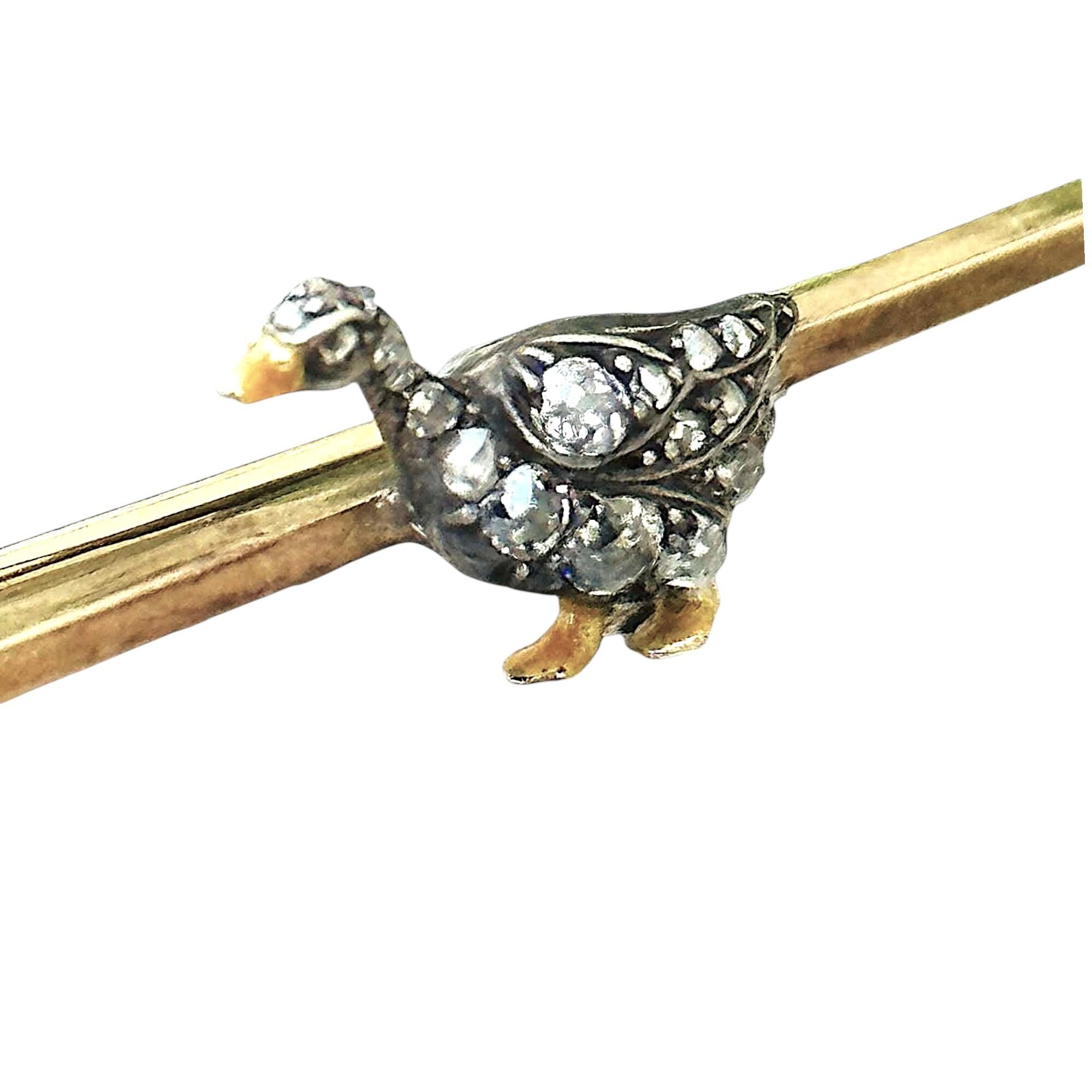 Antique Edwardian rose-cut diamond brooch with standing bird, rose gold bar, yellow enamel feet and beak,