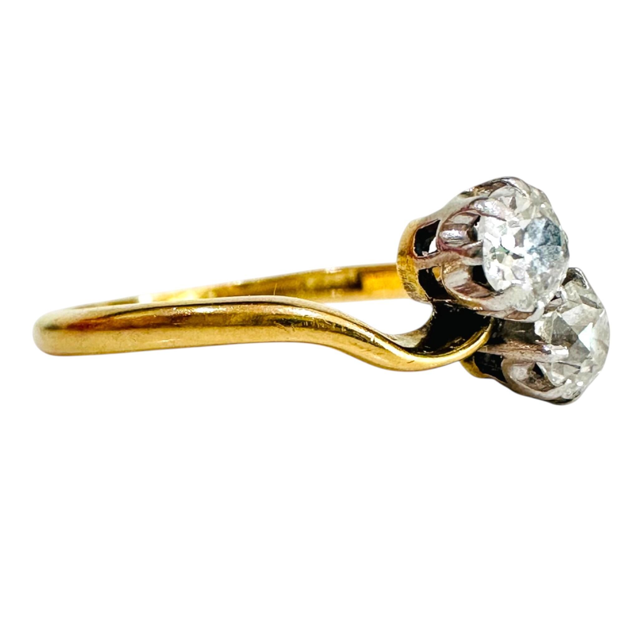 side view of 18ct Gold & Diamond Toi et Moi Ring with white background