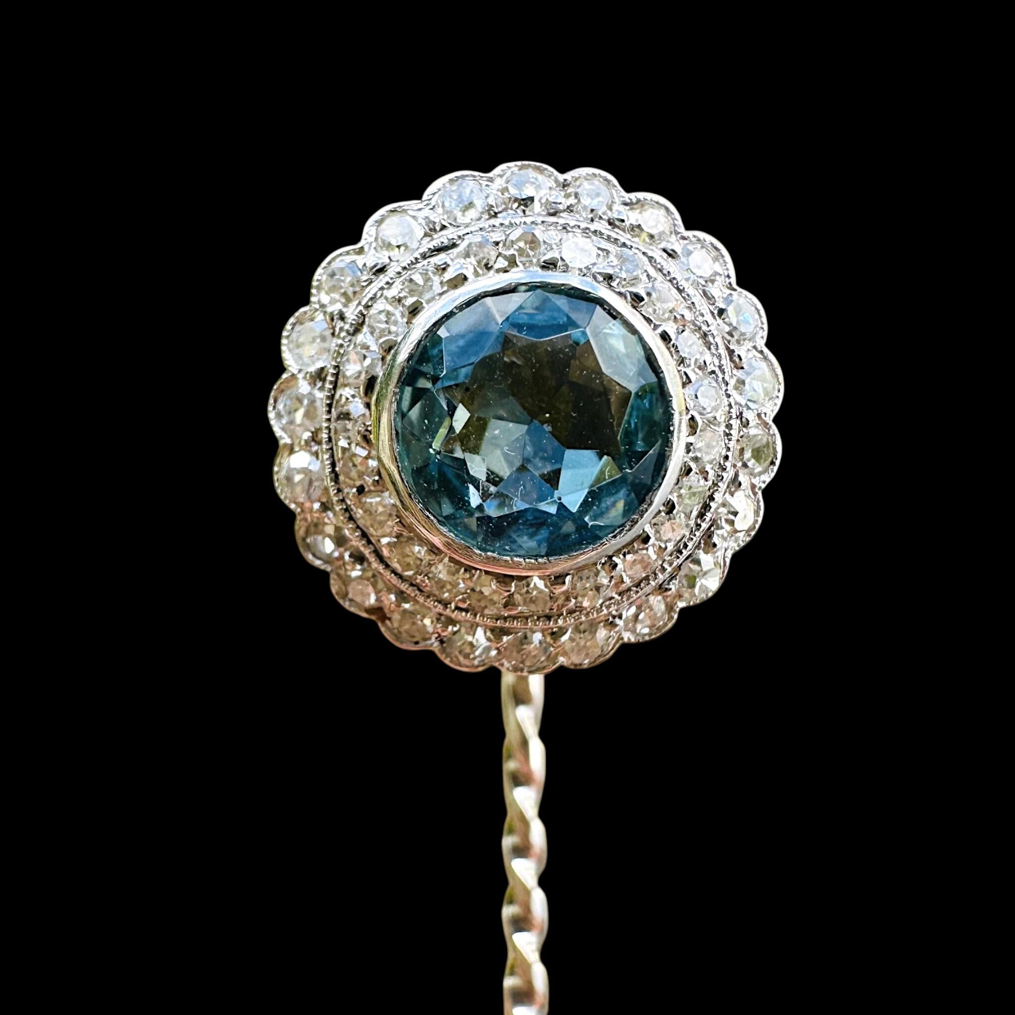 front view of Antique Art Deco Platinum Blue Zircon & Diamond Stick Pin with black background