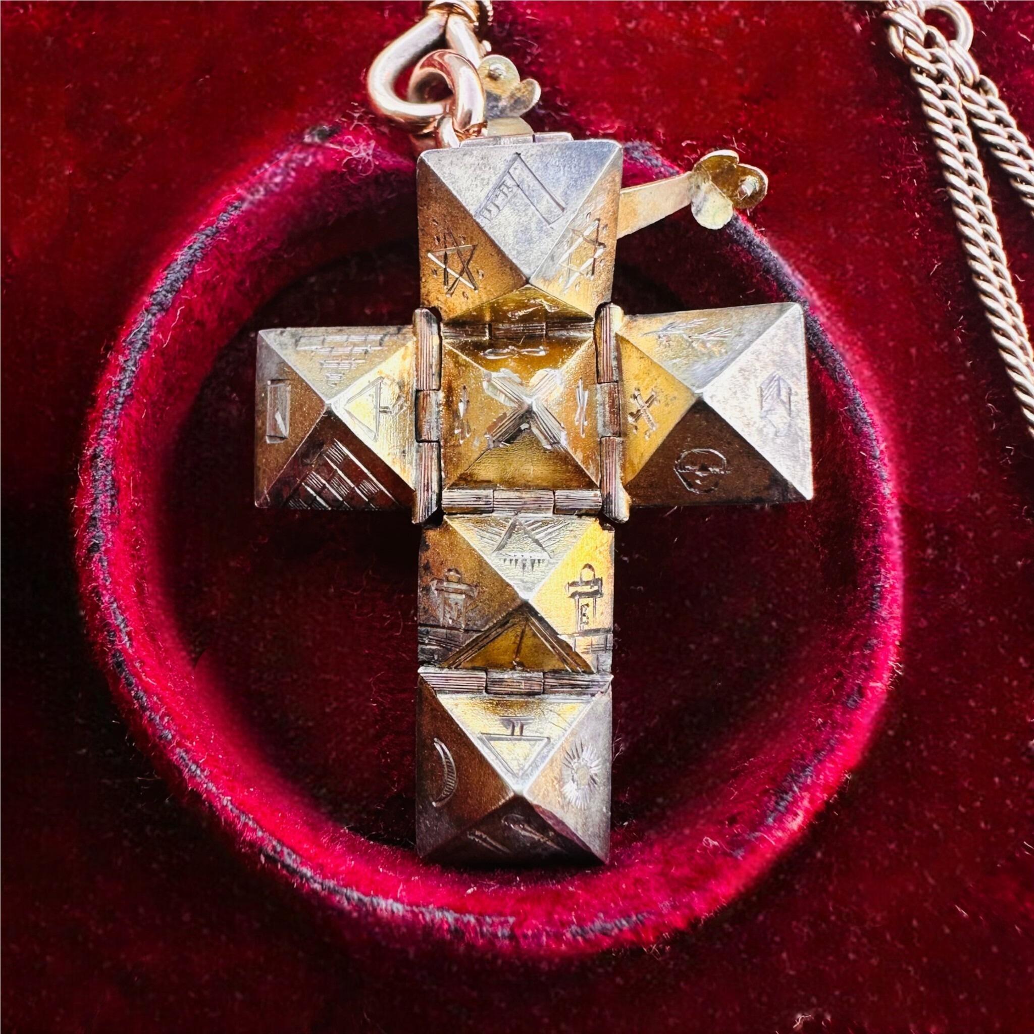 close up of Rare Antique Rose Gold, Opening Hexagonal Cross Masonic Pendant displayed on red antique box