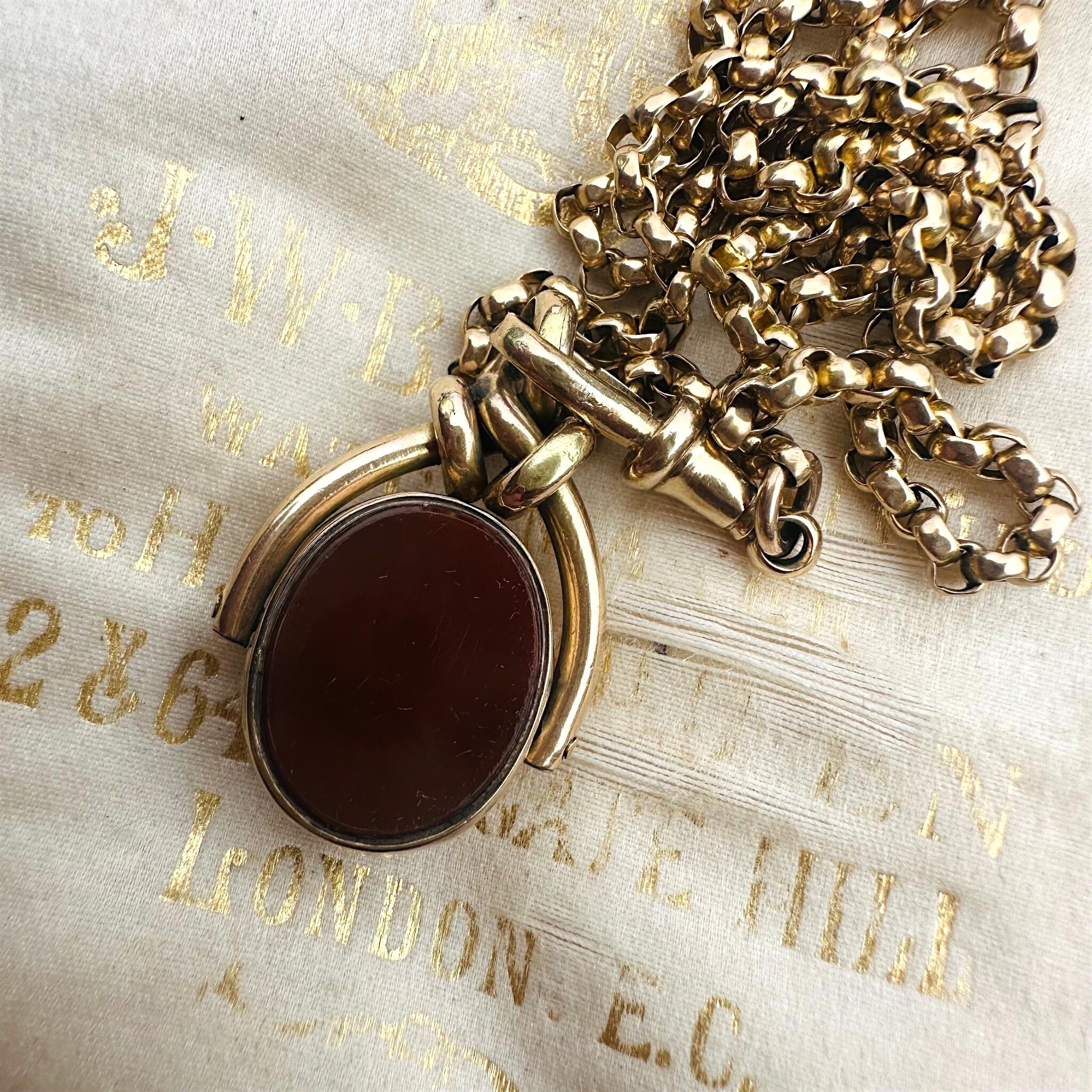 Antique Victorian 9ct Gold Bloodstone & Carnelian Swivel Fob displayed on antique box