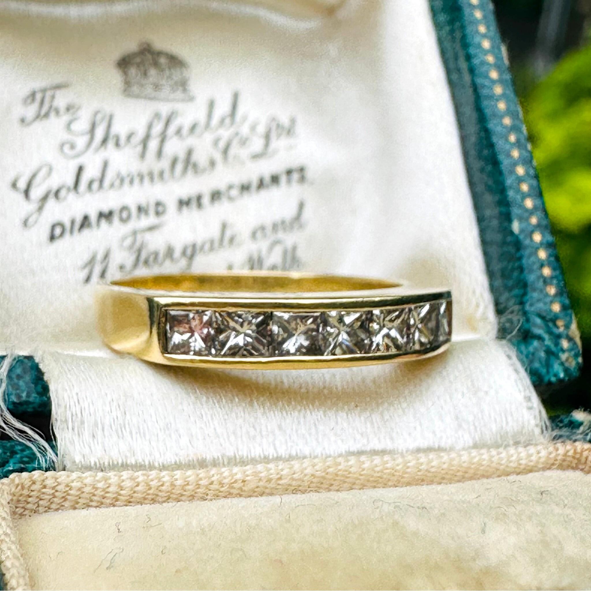 side profile of 18k Yellow Gold Princess Cut Diamond Half Eternity Ring laying in antique box