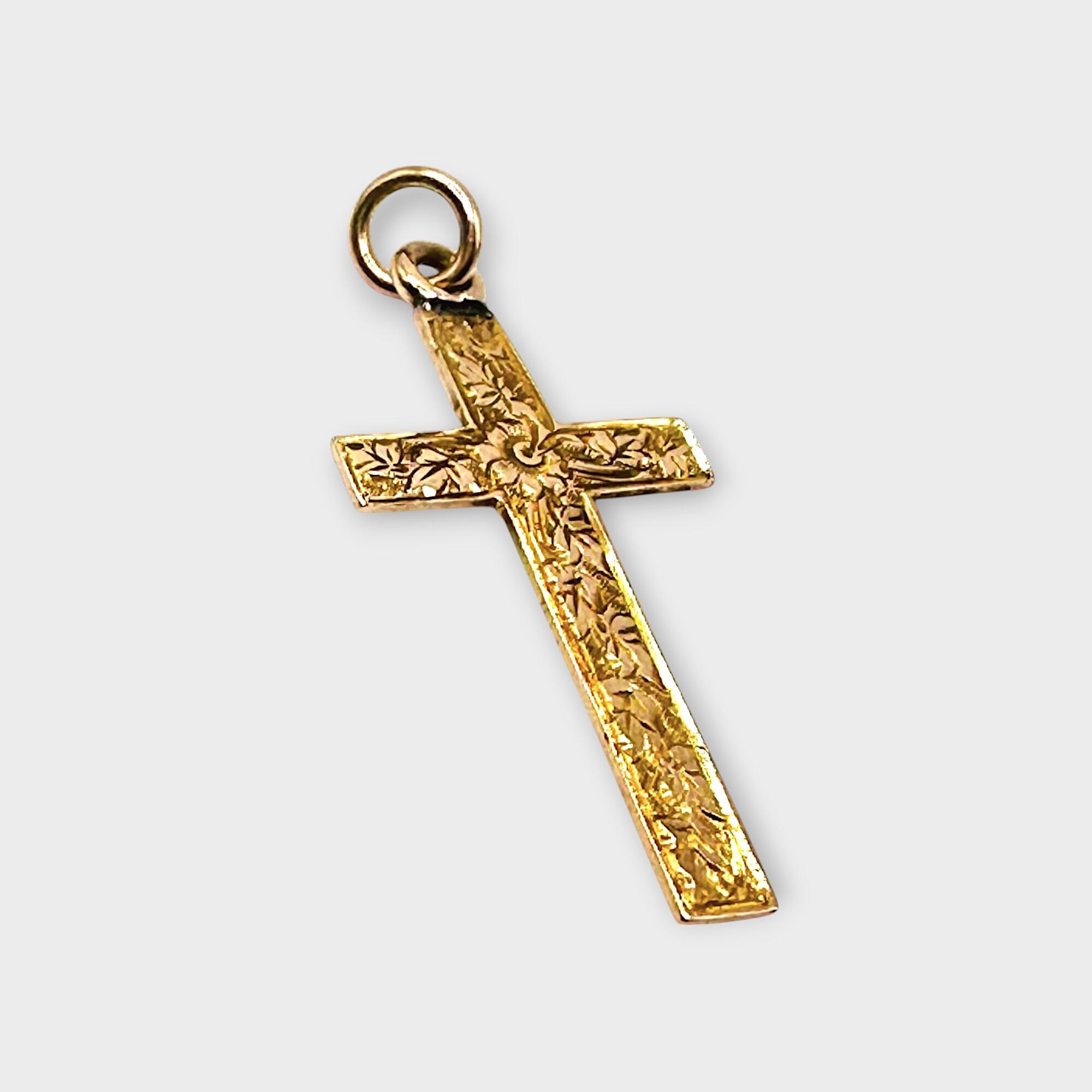 Victorian 9k rose gold engraved cross pendant on grey background