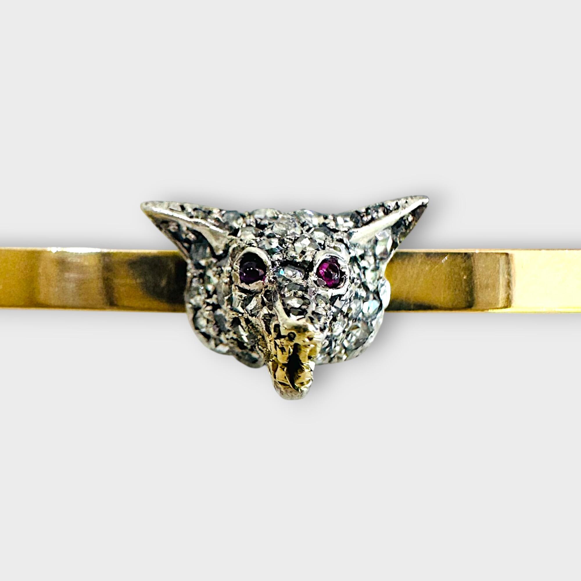 Antique diamond fox head brooch with rose cut diamonds, ruby eyes, and gold teeth detail