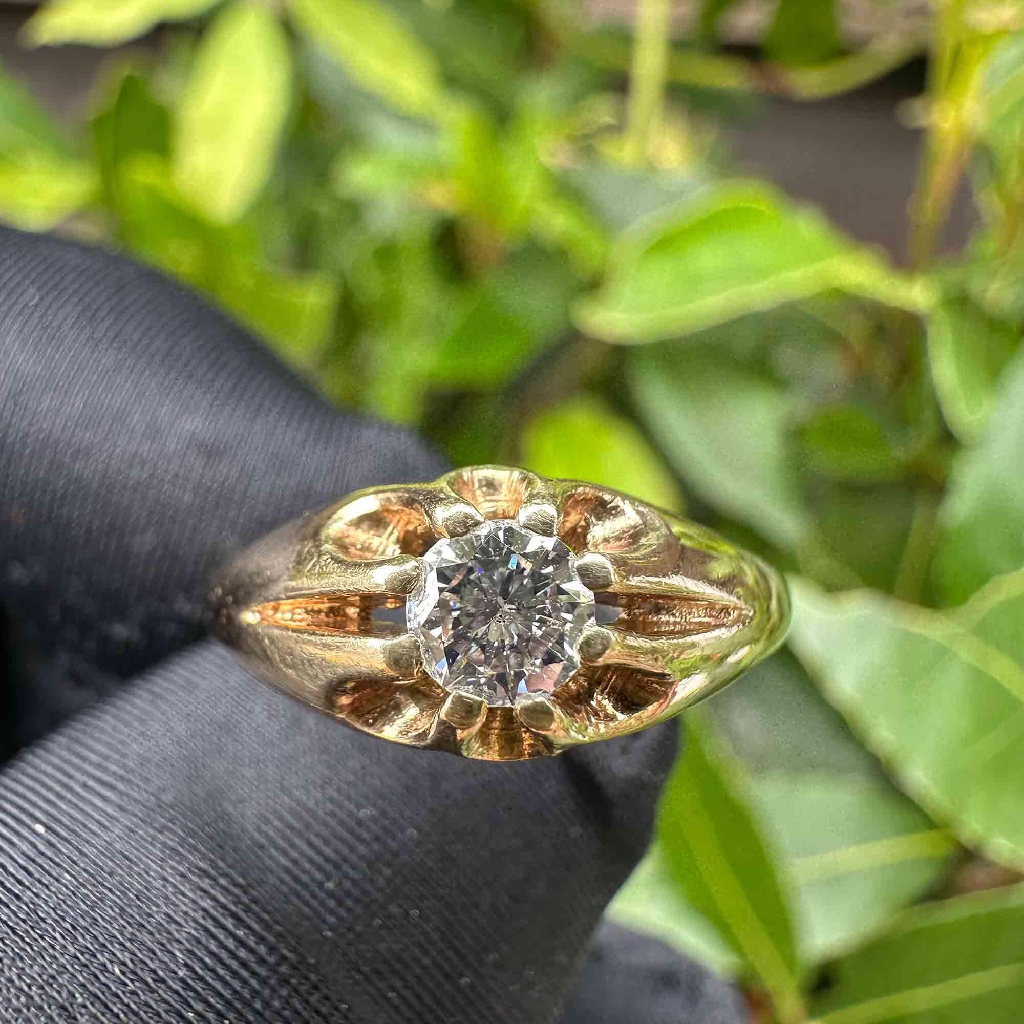 gents gold diamond solitaire gypsy ring in garden.
