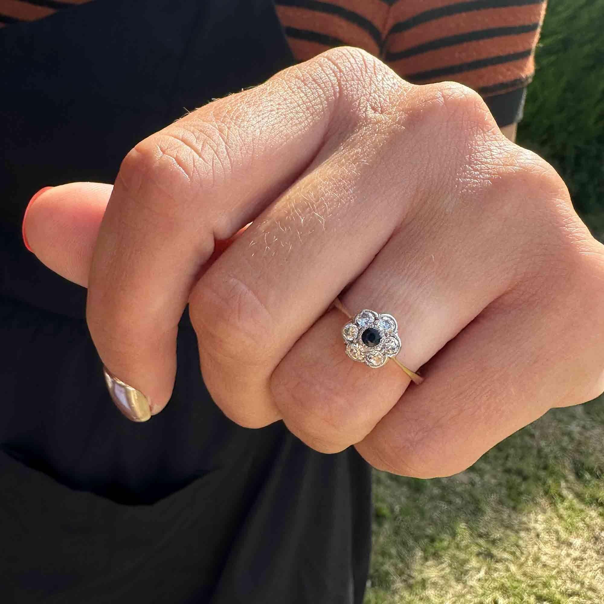 Art Deco 18k gold Sapphire and diamond cluster daisy ring on models hand