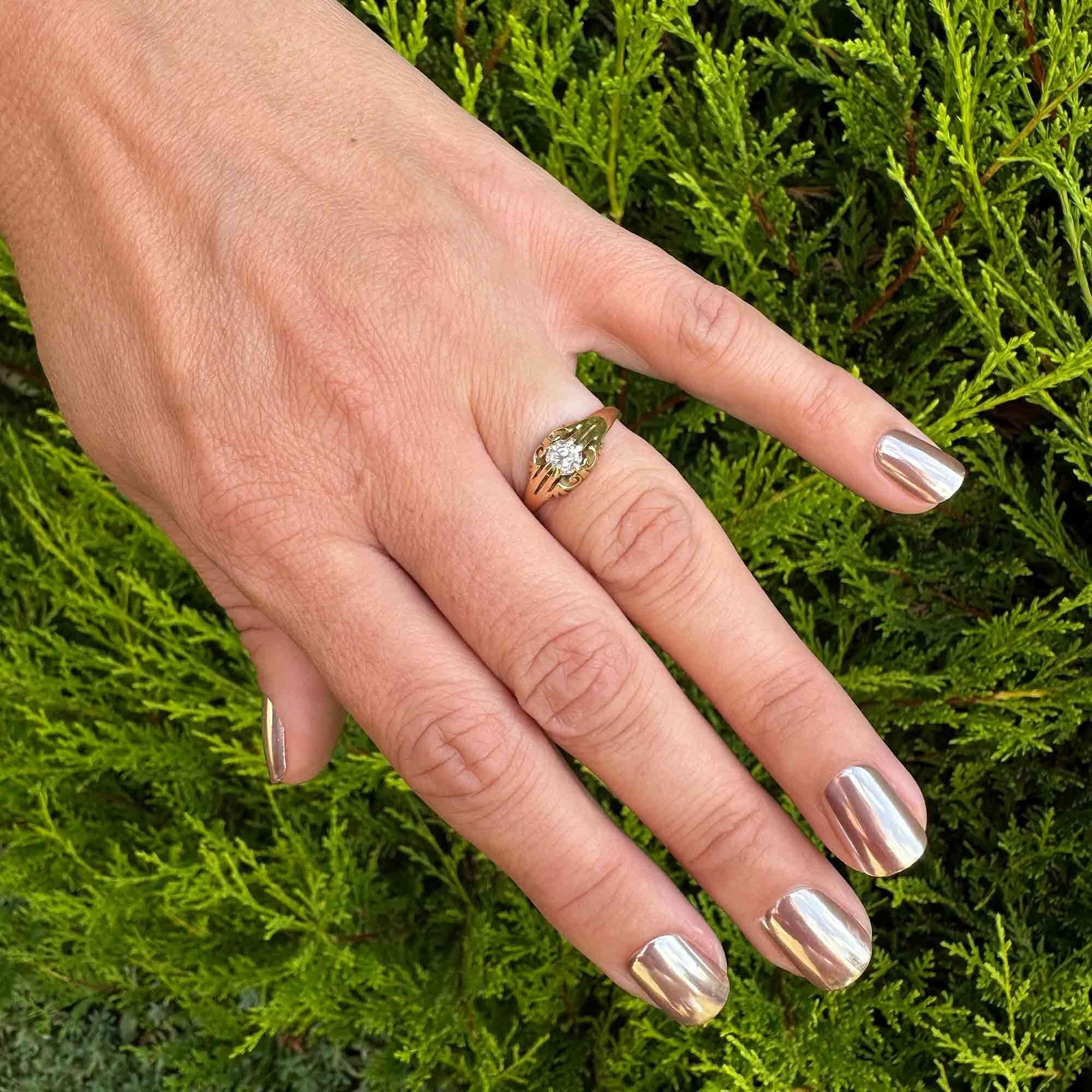 Victorian 18k yellow gold old cut diamond gypsy ring on models hand in garden