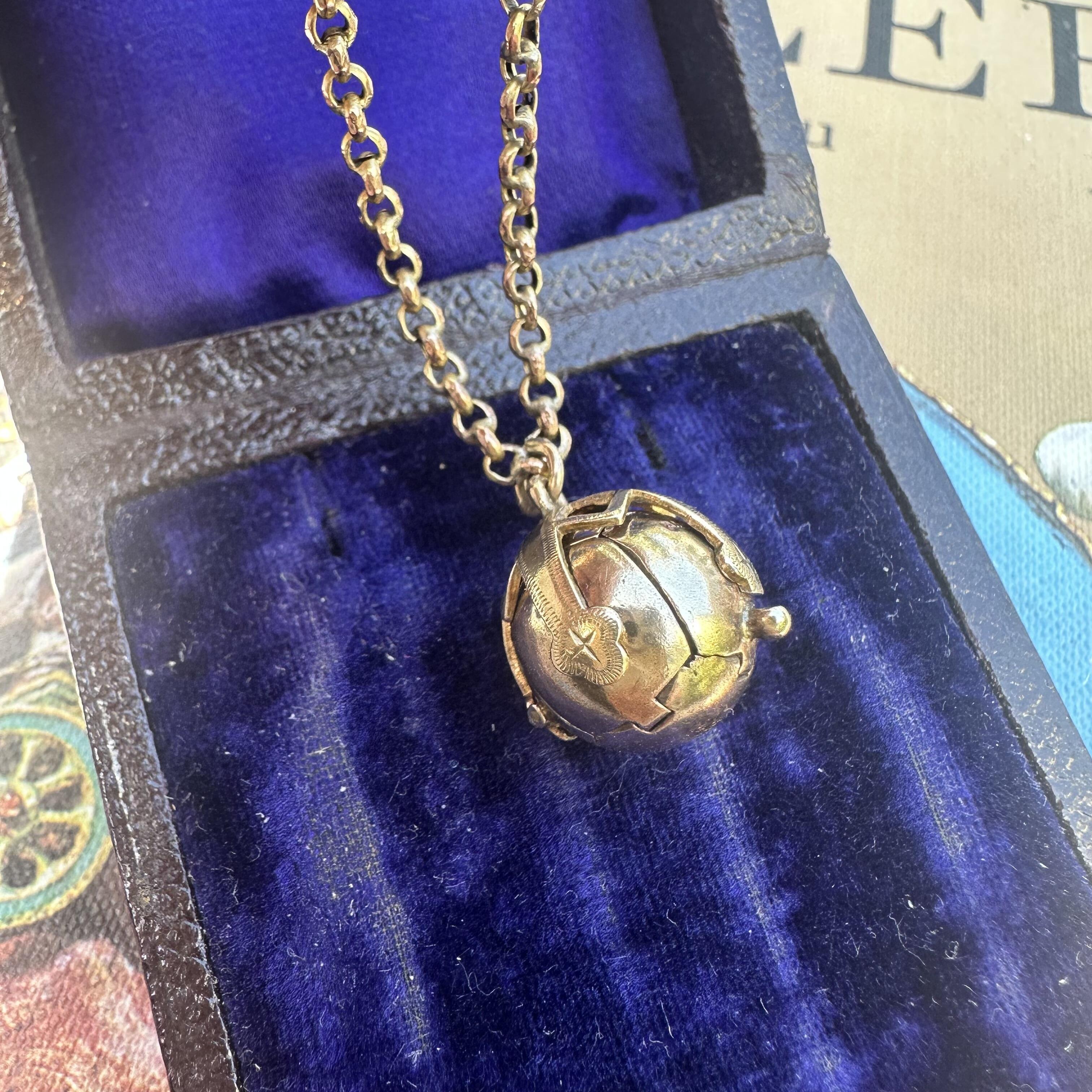 Victorian 9k gold masonic orb pendant on chain on blue velvet box