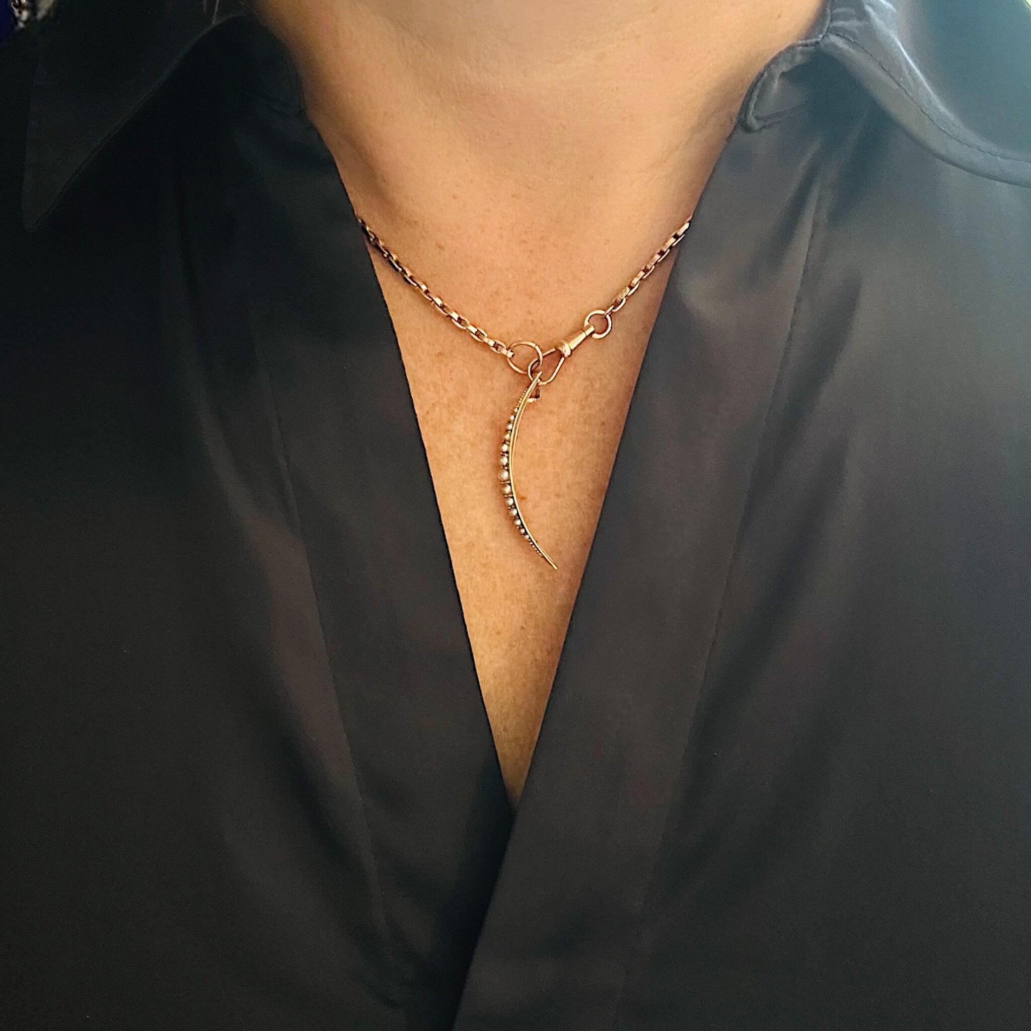 Antique 15ct gold crescent moon pendant set with seed pearls, Victorian era.