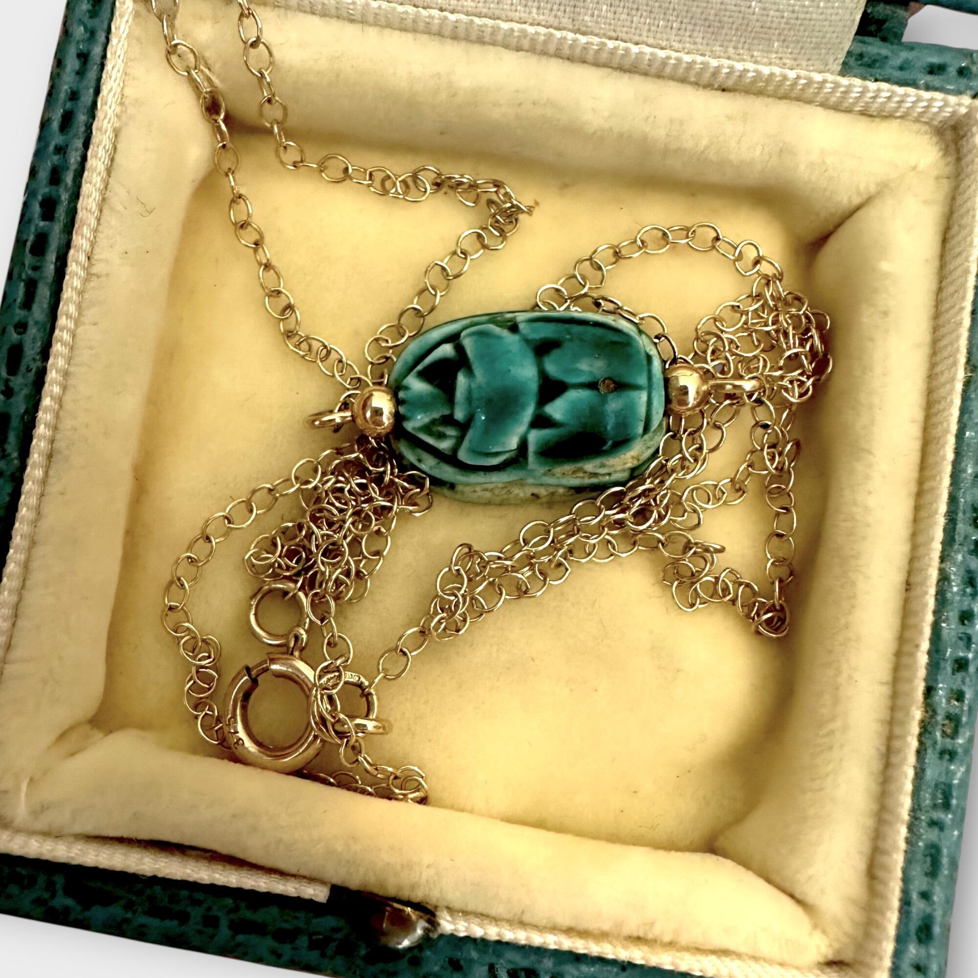 9k Gold Blue Faience Scarab Necklace – Egyptian Revival Pendant displayed on antique box