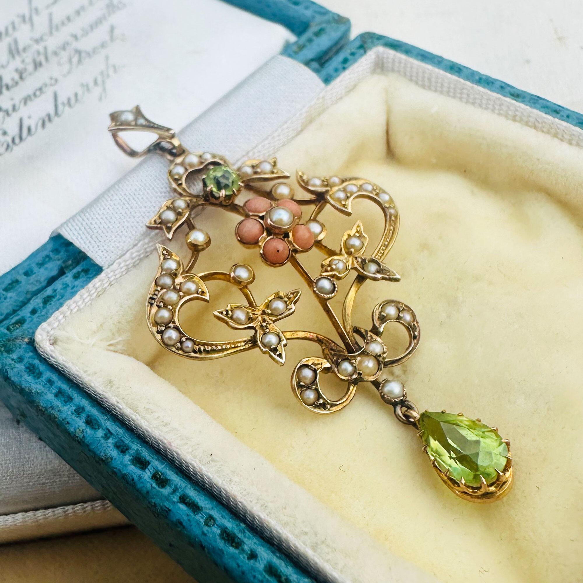 Art Nouveau 9k gold Lavaliere Pendant Peridot & Pearl Floral Motif, displayed in antique box.