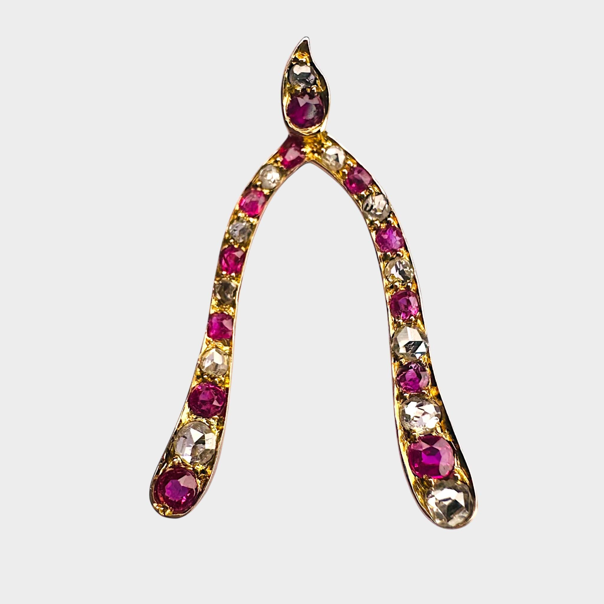 side view, Antique Ruby & Diamond Lucky wishbone brooch, 17x27.5mm with grey background.