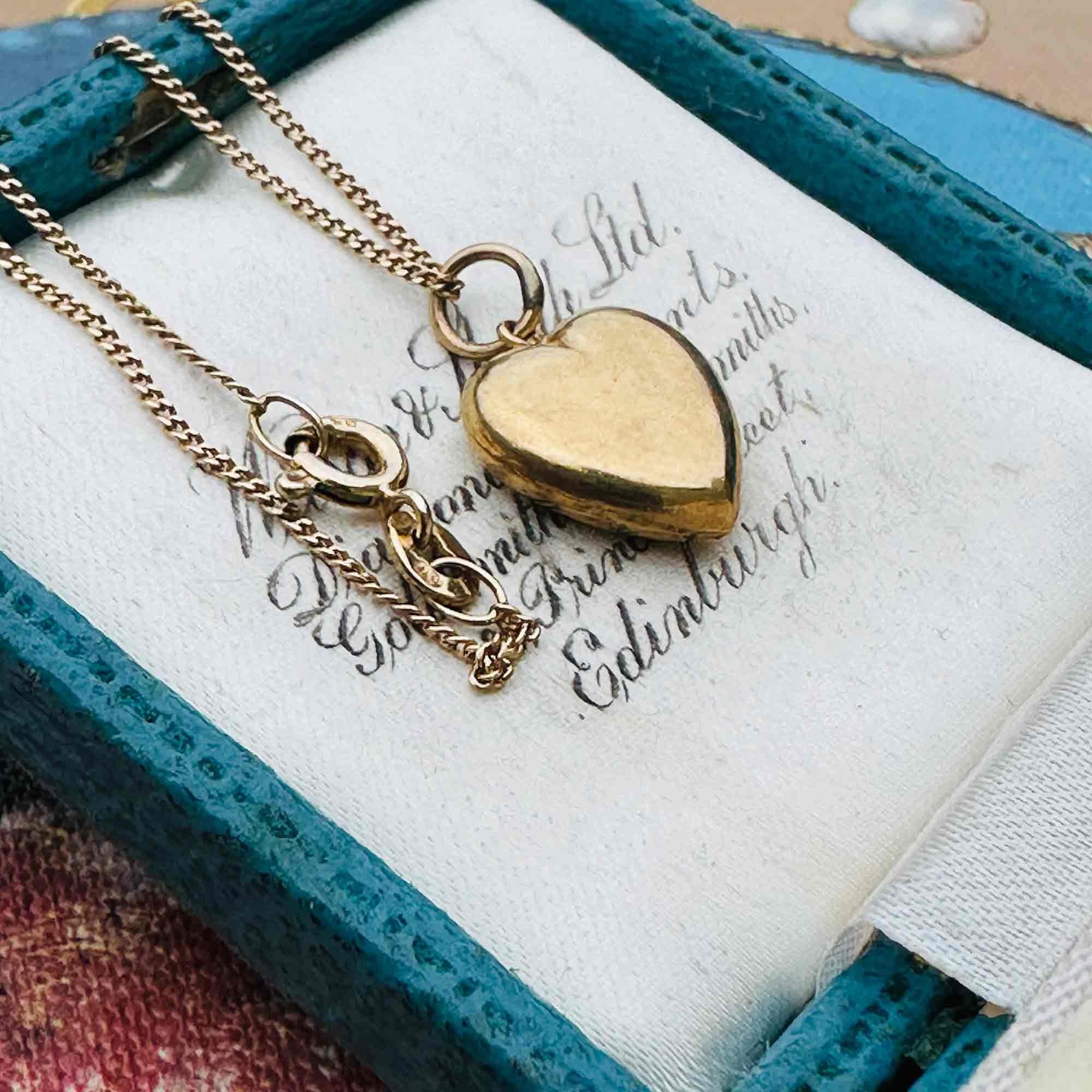 Gold Puffy Heart Necklace with Chain Dating 1942, displayed in a antique box.