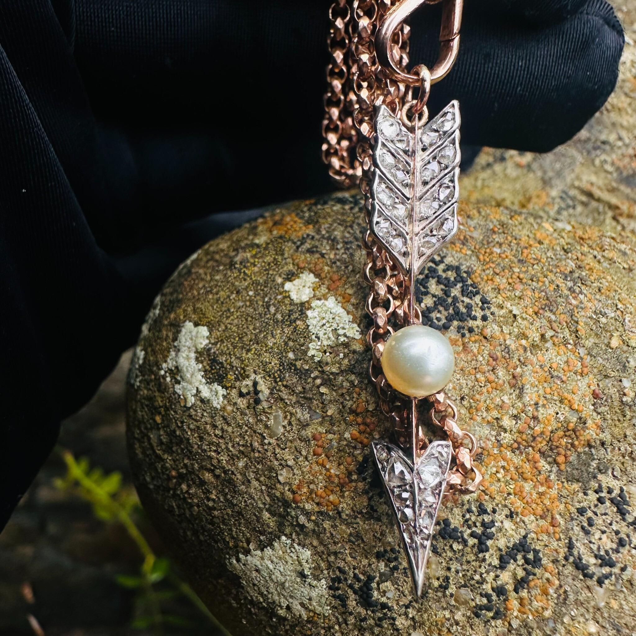 Victorian Rose Cut Diamond & Pearl Cupid’s Arrow Pendant, textured background