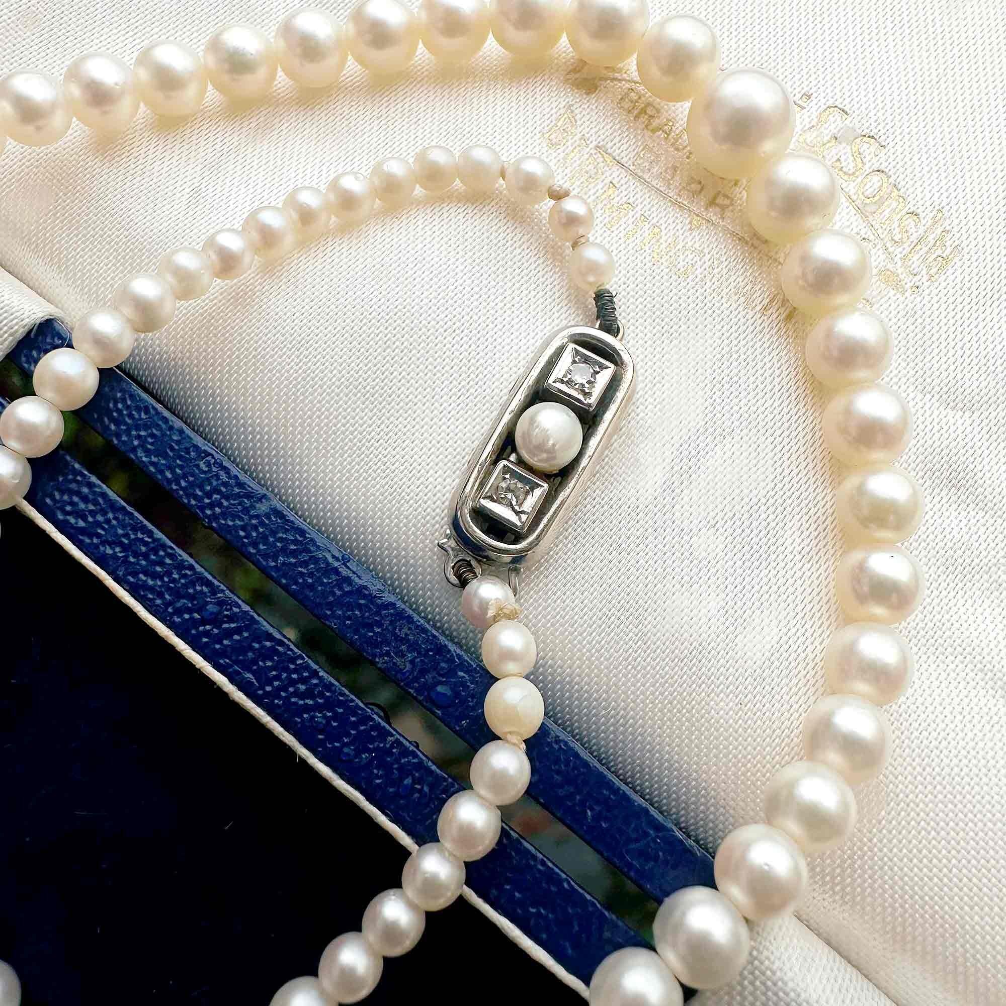 Saltwater Cultured Pearl & 14ct White Gold Diamond Clasp Necklace, displayed on antique box.