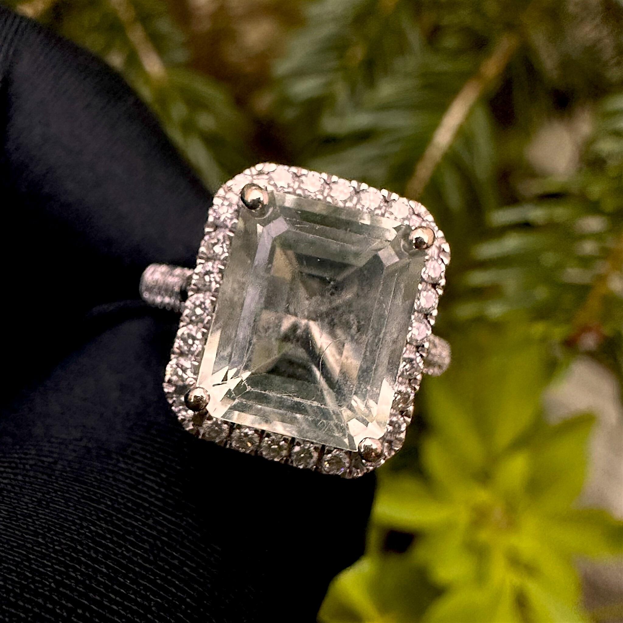 Diamond Halo & Prasiolite Cluster Ring in 14k White Gold displayed in garden.