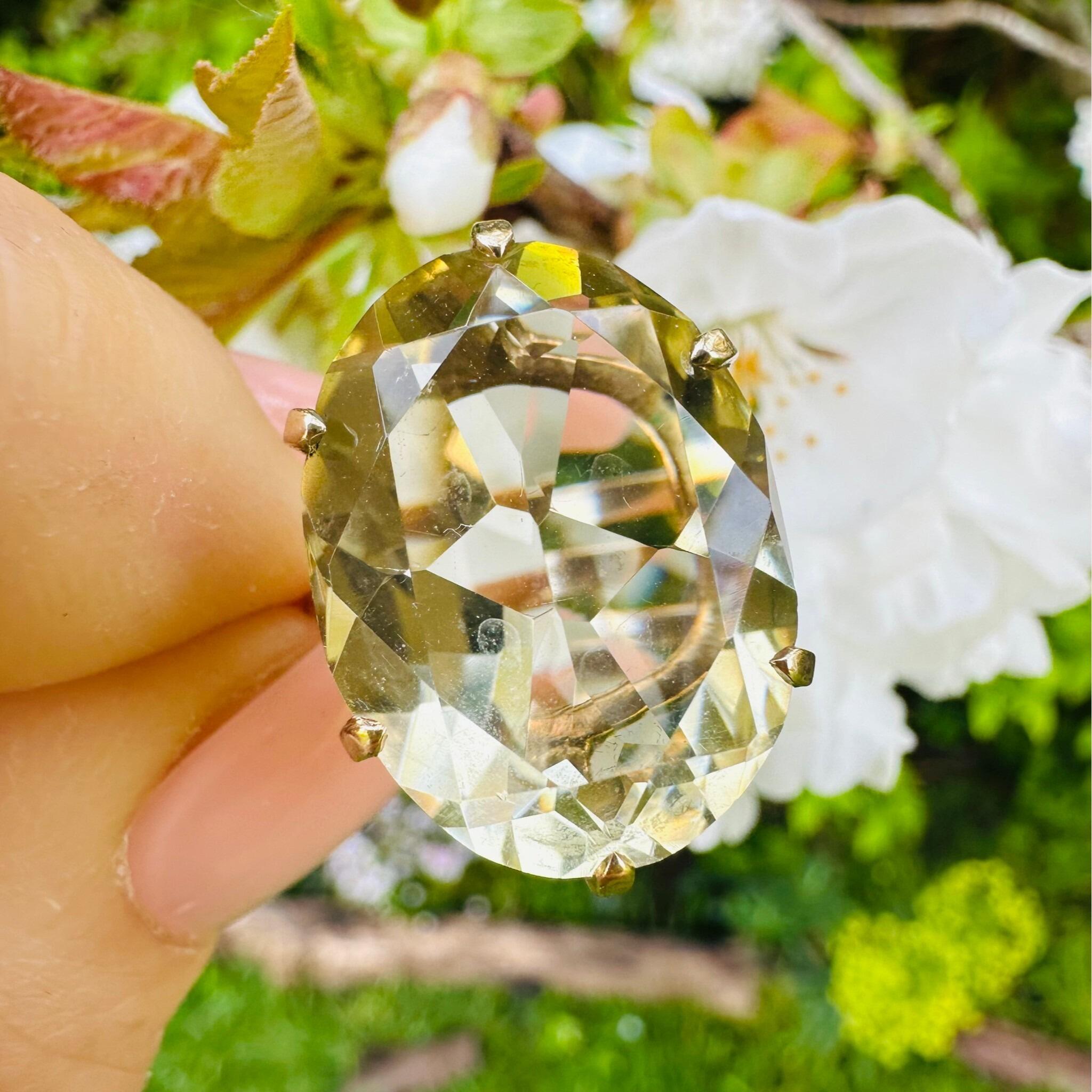 Vintage 9K Gold Oval Citrine Statement Ring, London 1985 Hallmarked Cocktail Ring held in garden
