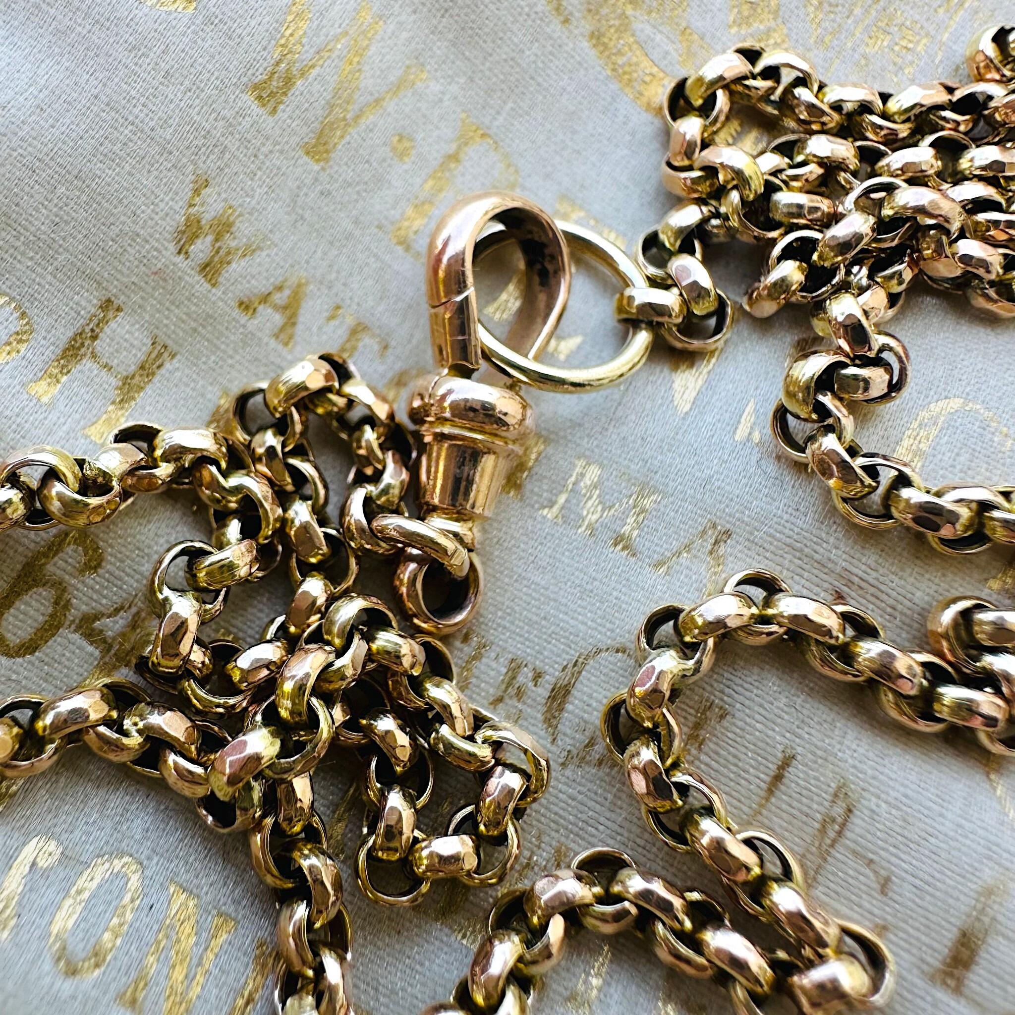 Antique Gold Belcher Link Chain Necklace & Dog Clip displayed laying on antique box