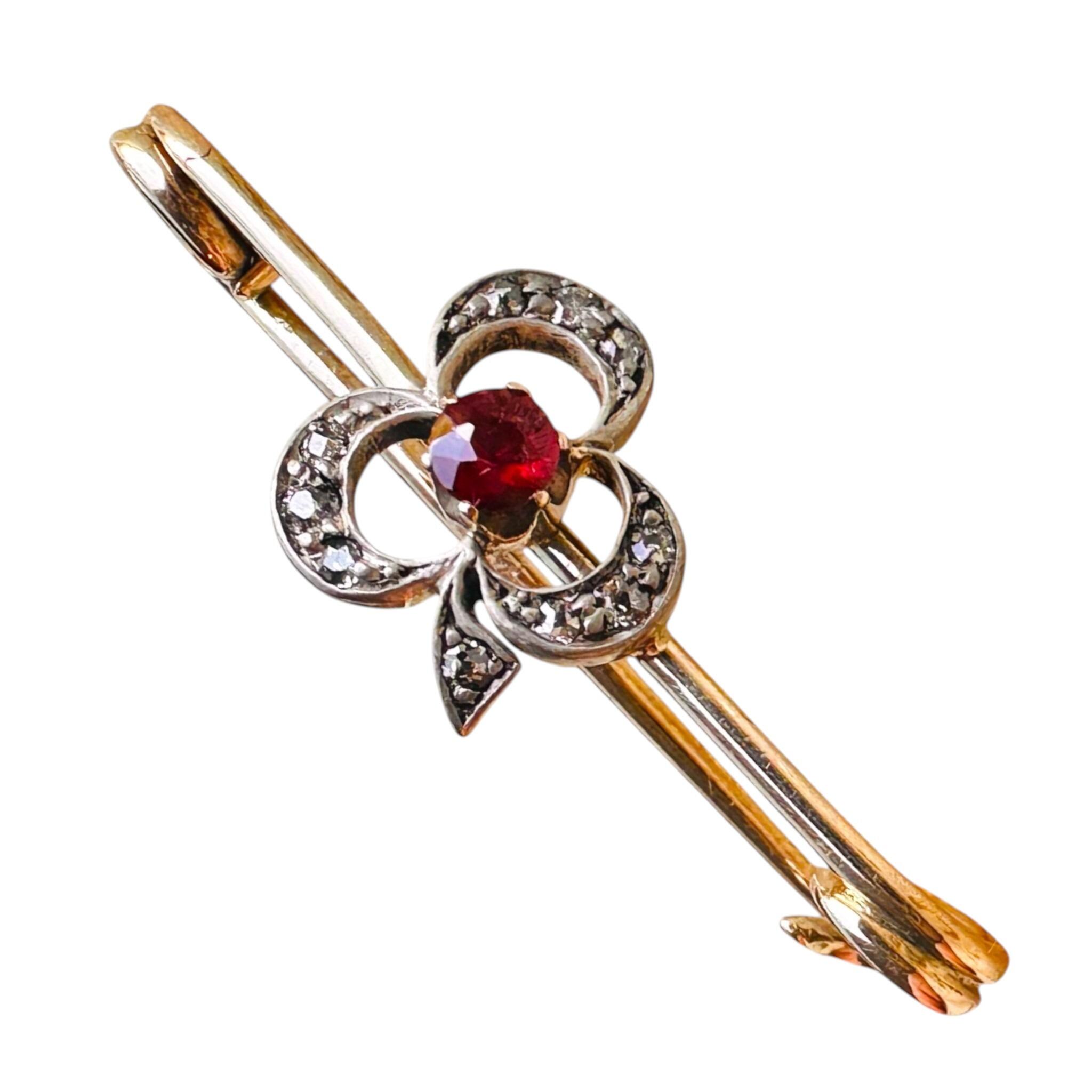 Antique Ruby and Diamond Shamrock Brooch, white background.