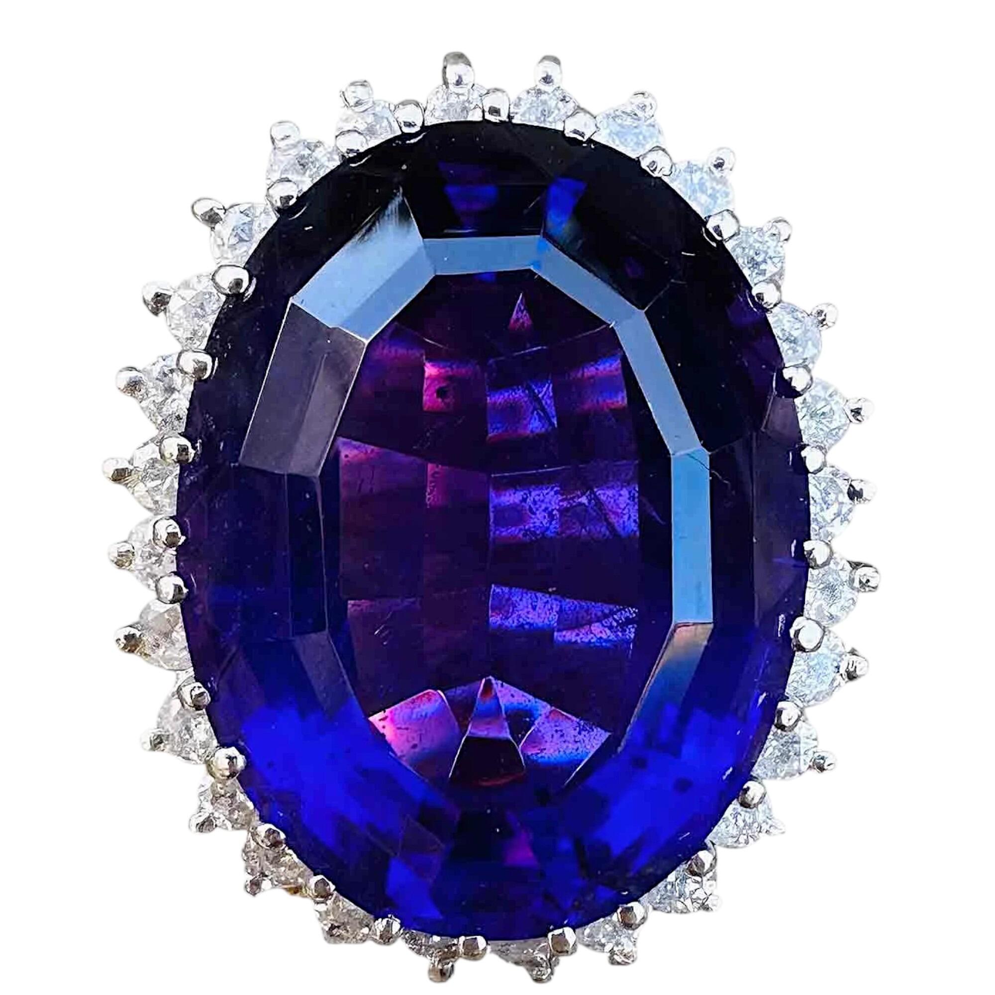 18k white gold large oval amethyst ring with diamond surround on white background