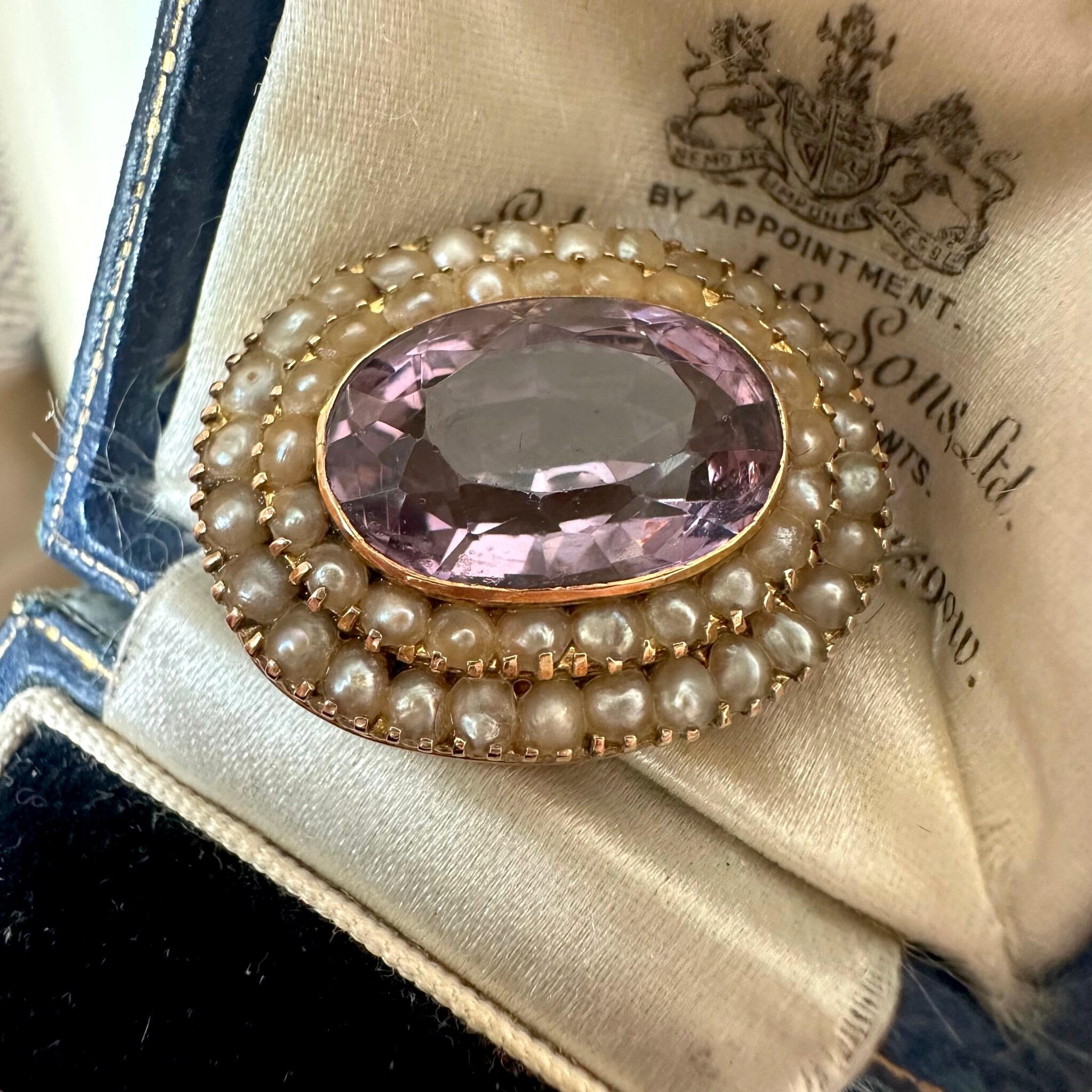 Antique Victorian Gold Rose de France Amethyst & Seed Pearl Brooch displayed on antique box
