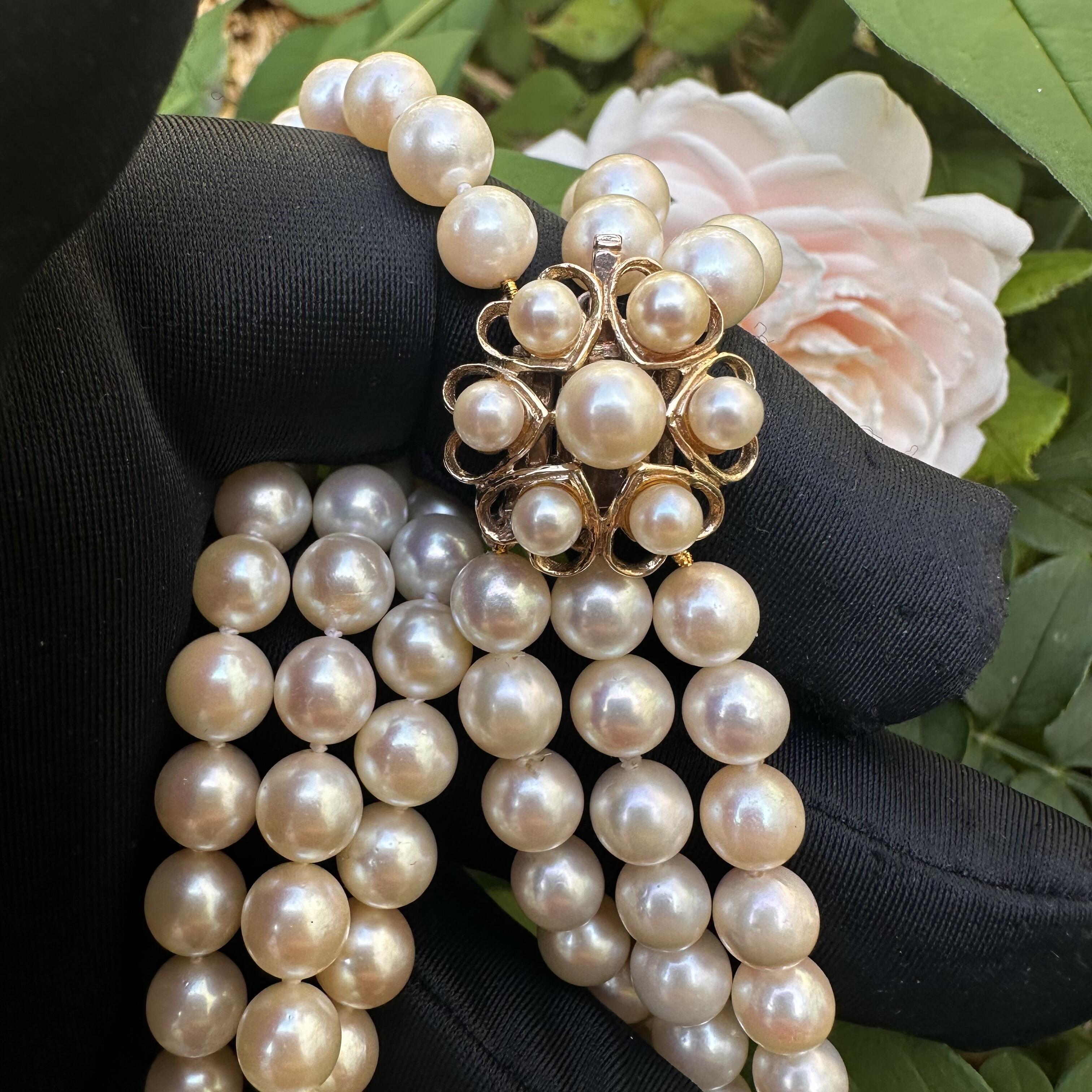 Vintage Cultured Saltwater Pearl 3 Row Necklace with Gold Pearl Cluster Heart Clasp held in garden