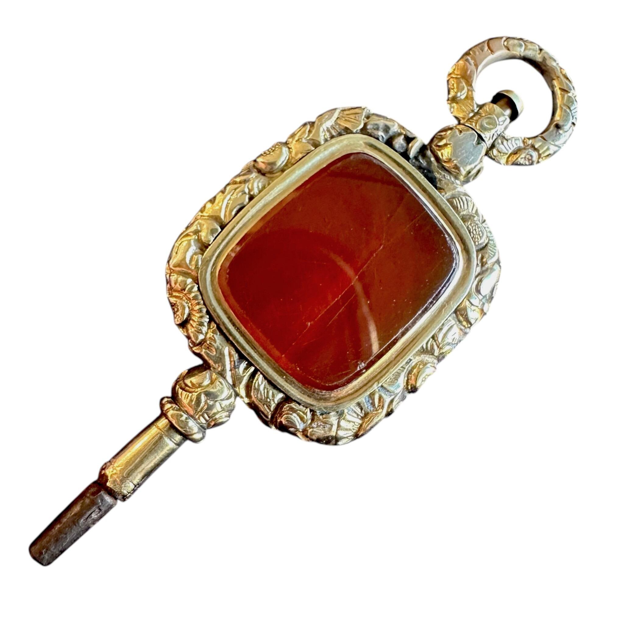 front view of Antique Georgian Carnelian Watch Key Pendant with white background