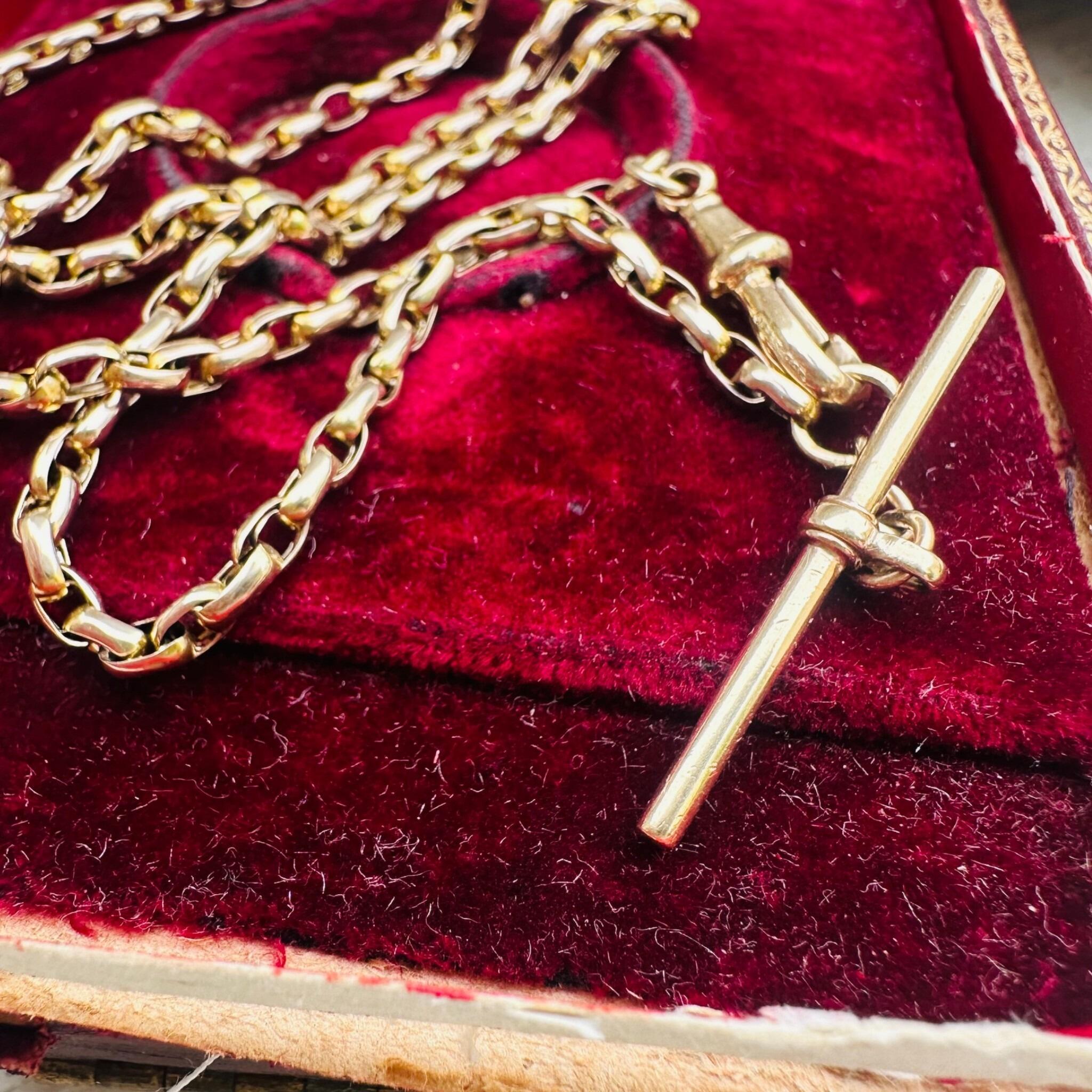 Antique Victorian Gold Bike Link Chain, Dog Clip & T-bar Clasp displayed on antique box