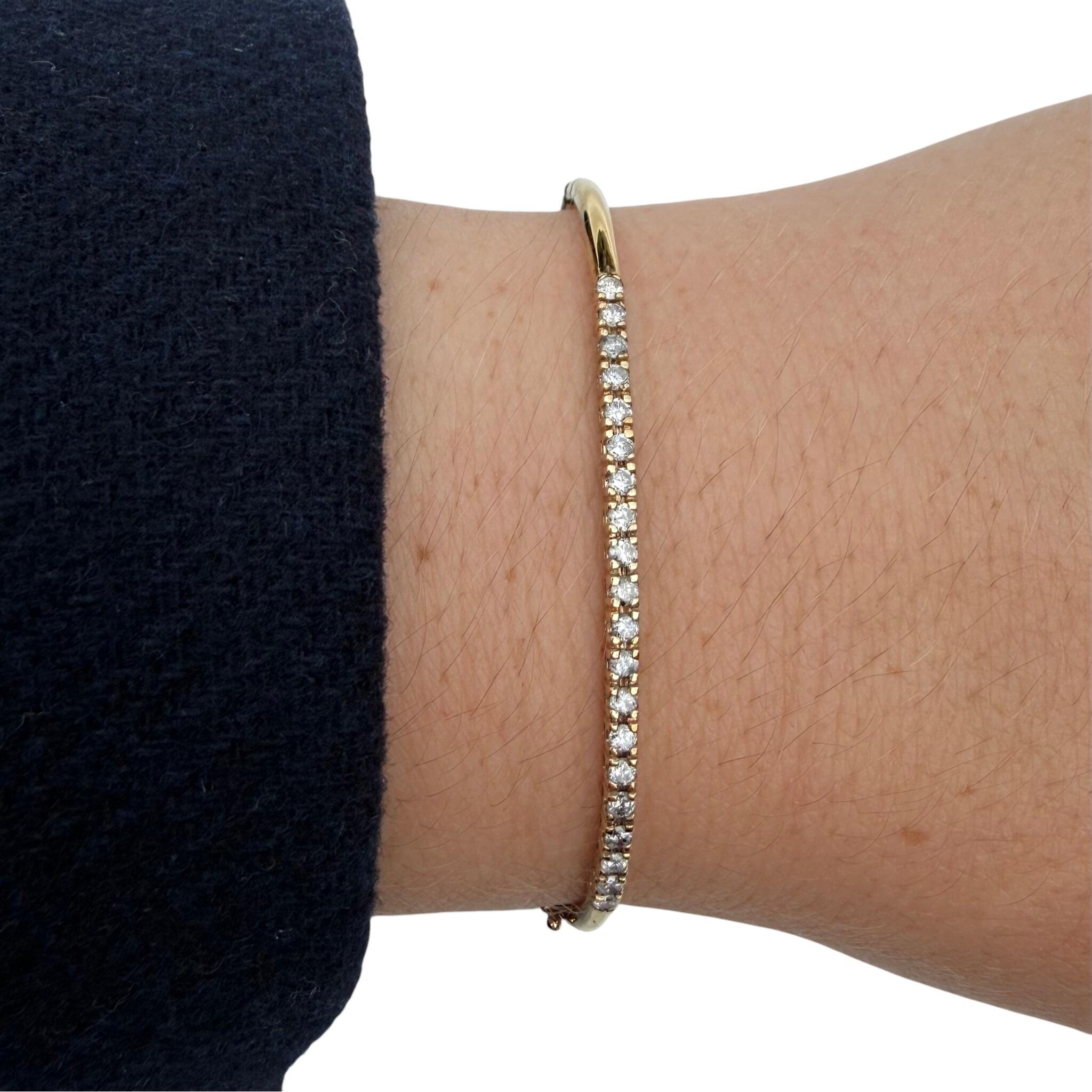 Vintage Gold & Diamond Tennis Style Bangle worn on models wrist with white background