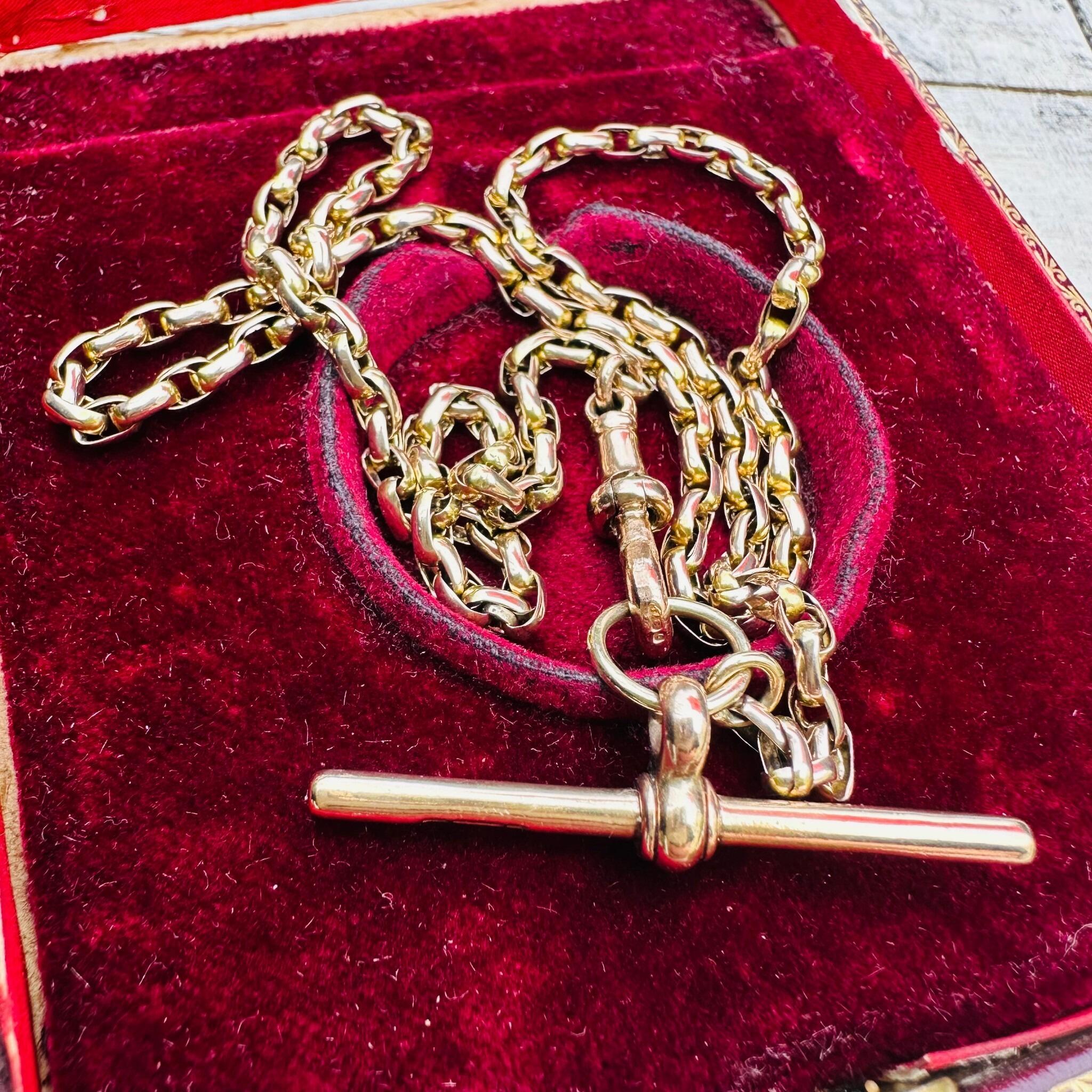 Antique Victorian gold bike link necklace displayed flat to show its elegant proportions.