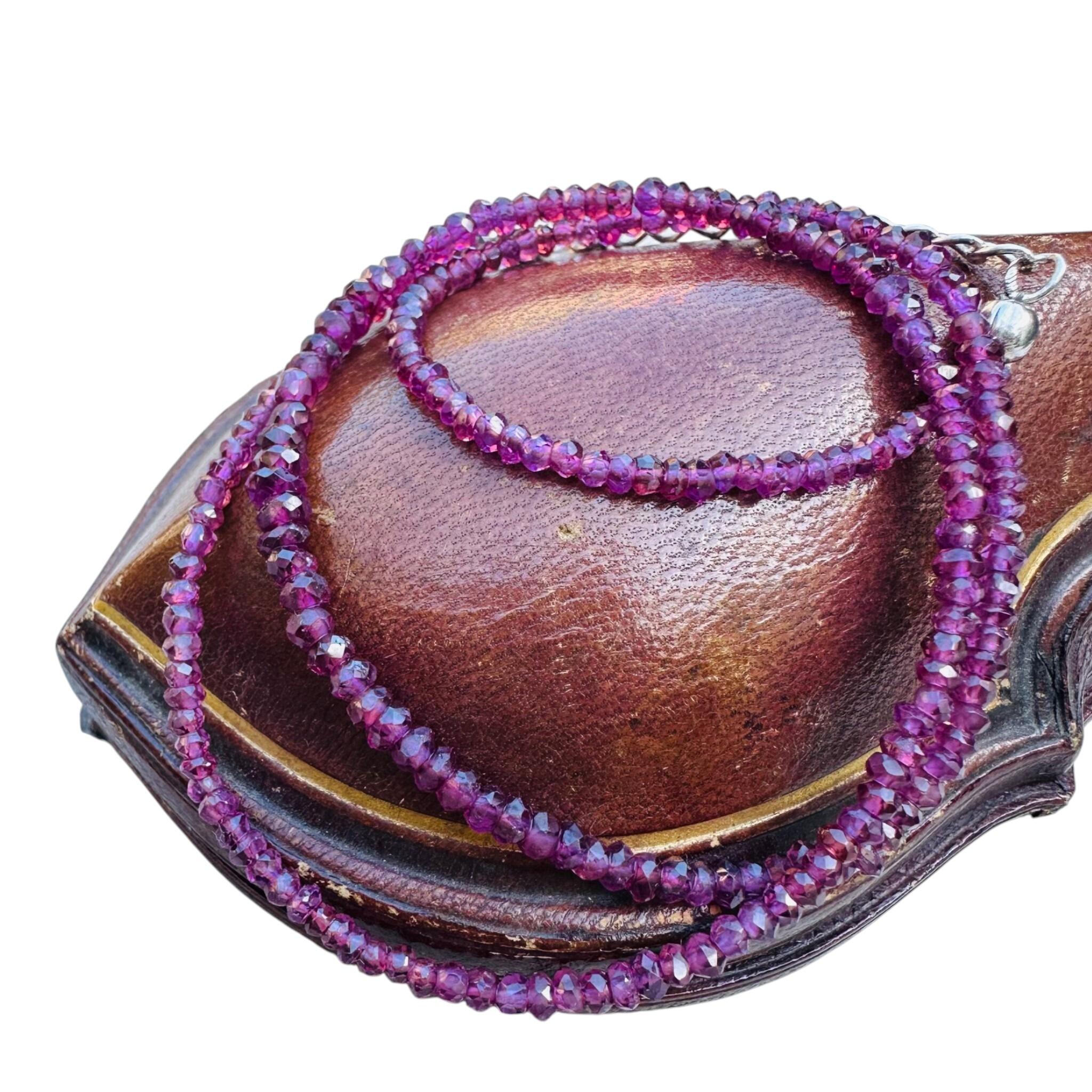 Silver & Amethyst Bead Necklace displayed on antique box with white background