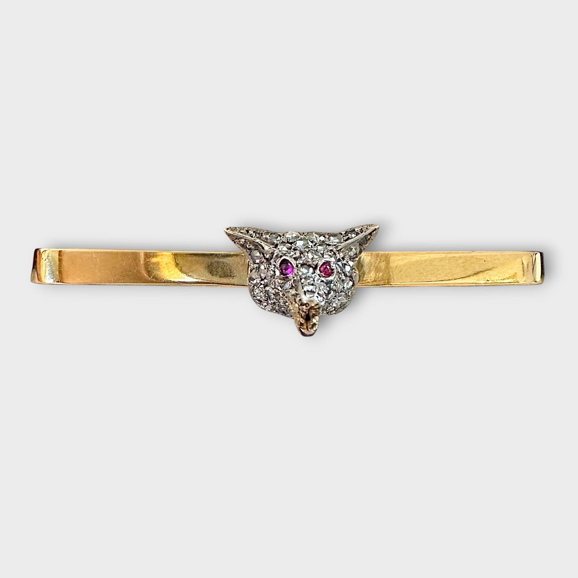 Antique diamond fox head brooch with rose cut diamonds, ruby eyes, and gold teeth detail