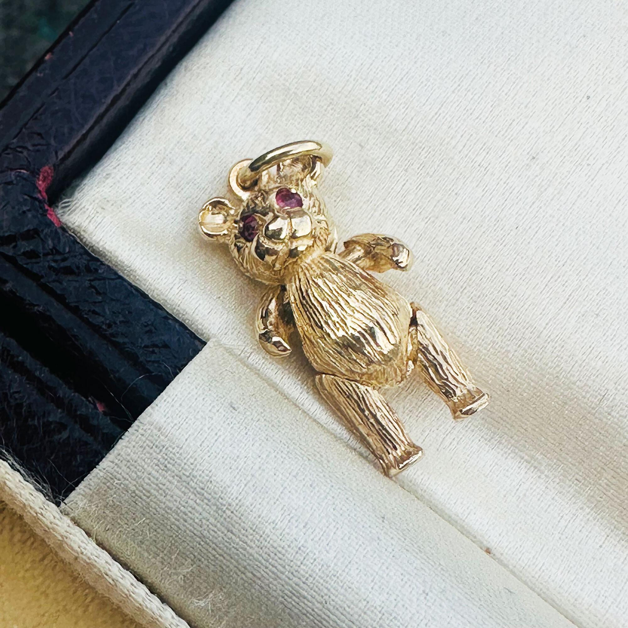 Vintage 9ct Gold Teddy Bear Pendant: Ruby Eyes, Articulated London Charm displayed in antique box