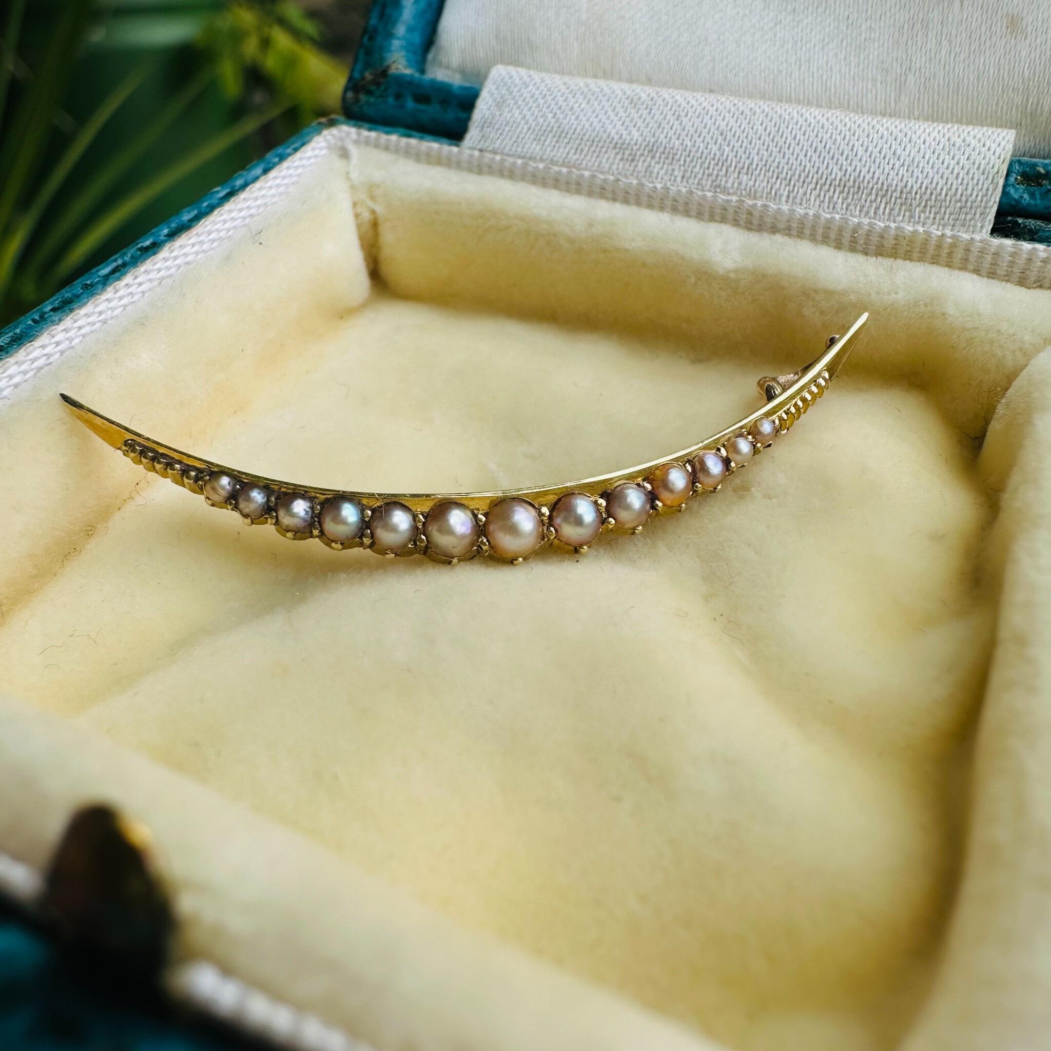 Antique 15ct gold crescent moon pendant set with seed pearls, Victorian era.